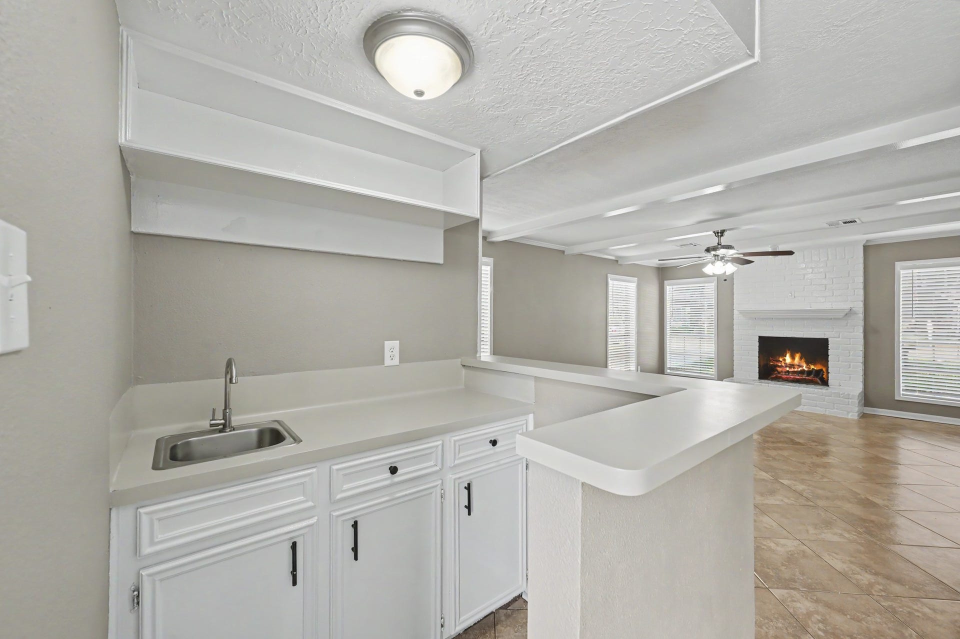 Built-in wet bar with additional storage and counter space, perfect for entertaining.