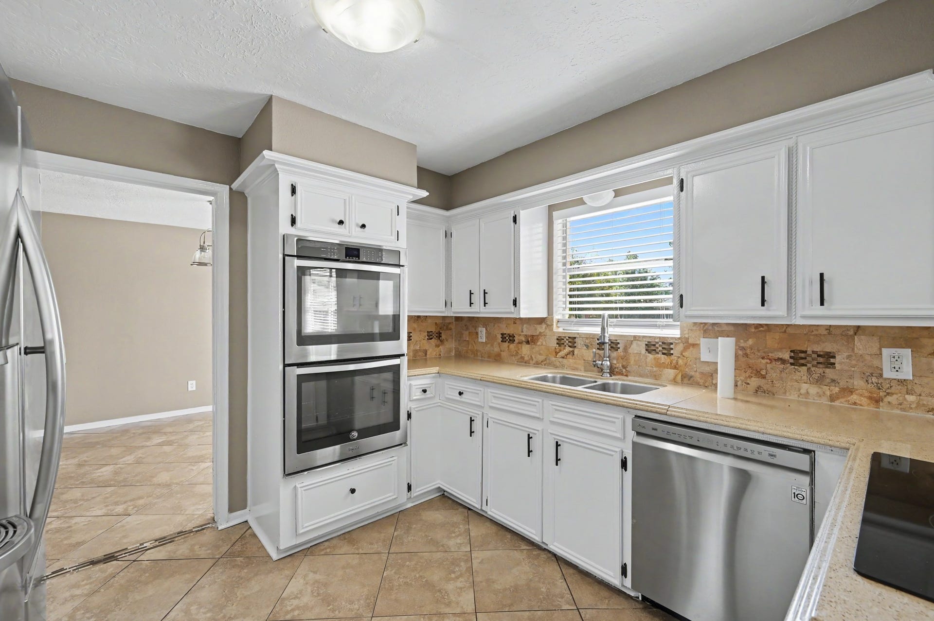 Double ovens, abundant cabinet storage, and a convenient double-basin sink.