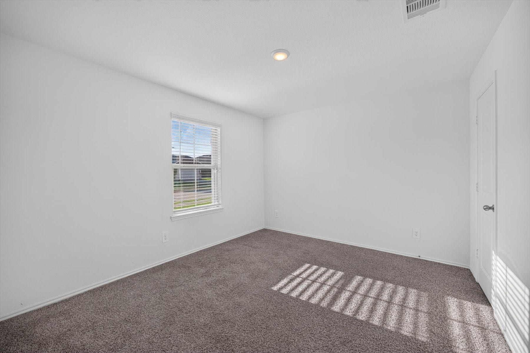 Versatile secondary bedroom perfect for guests or a home office.