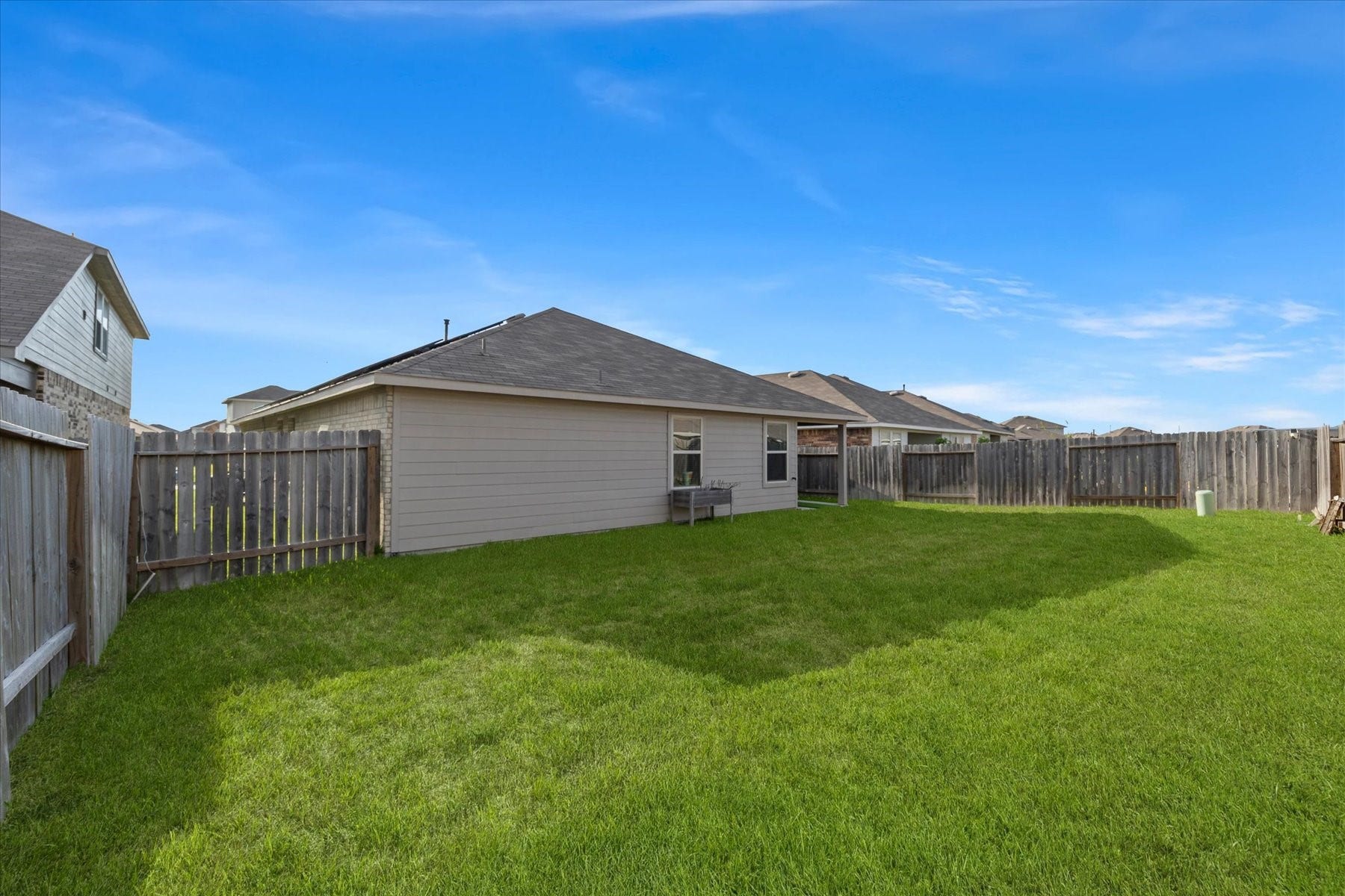 Expansive backyard ready for pets, play, or a future pool.
