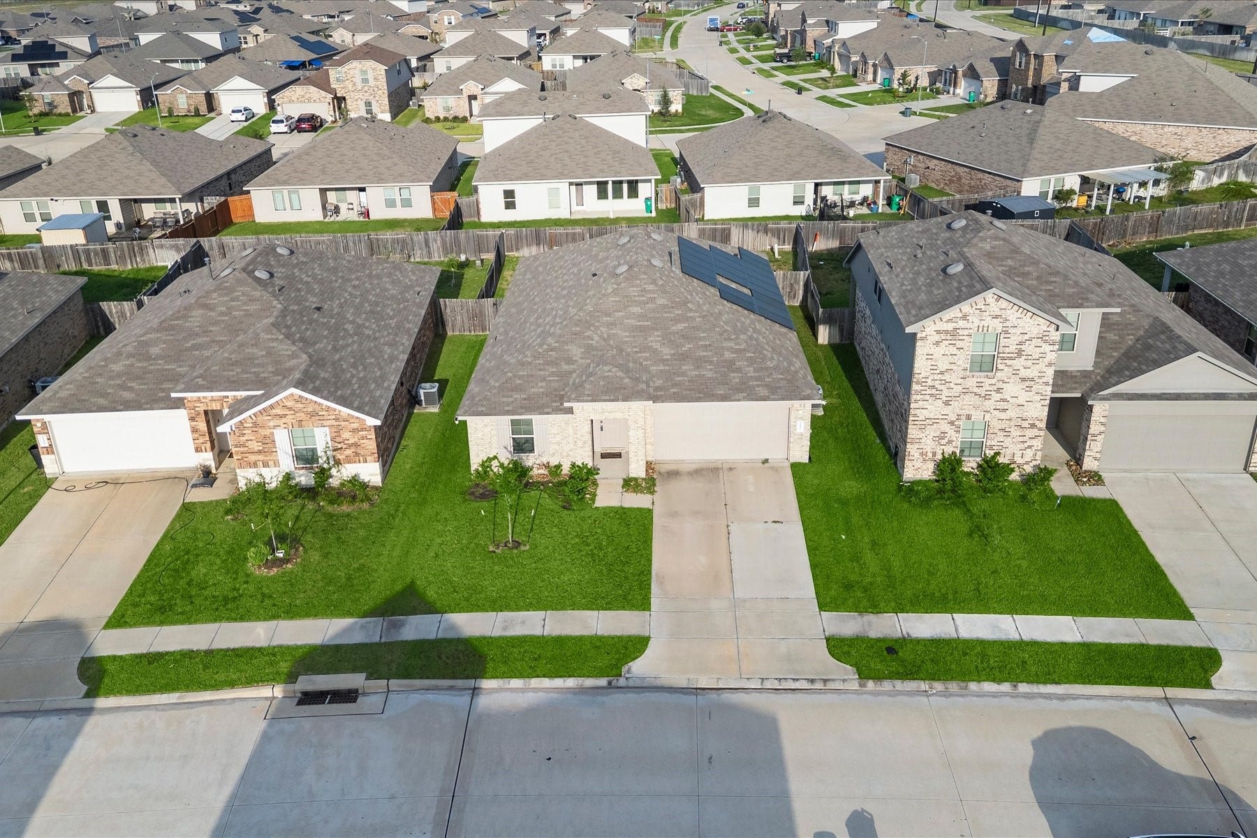 Aerial view showcasing the home and neighborhood.