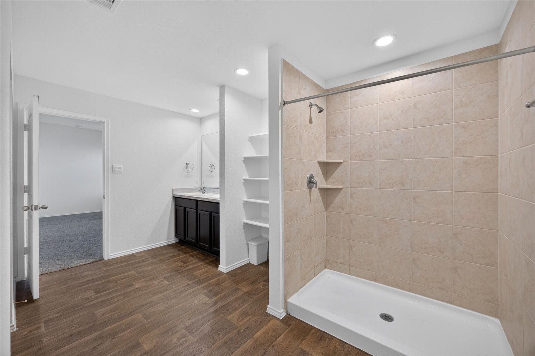 Primary bath featuring a walk-in shower.