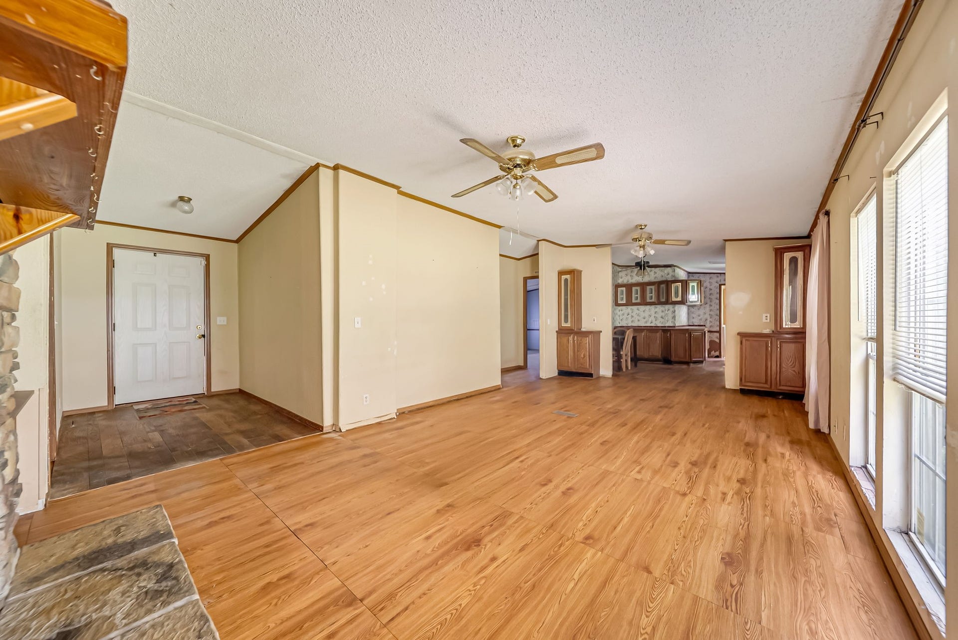 The spacious open-concept living area offers a flexible layout with abundant natural light, creating the perfect space to gather, entertain, or personalize to your style.