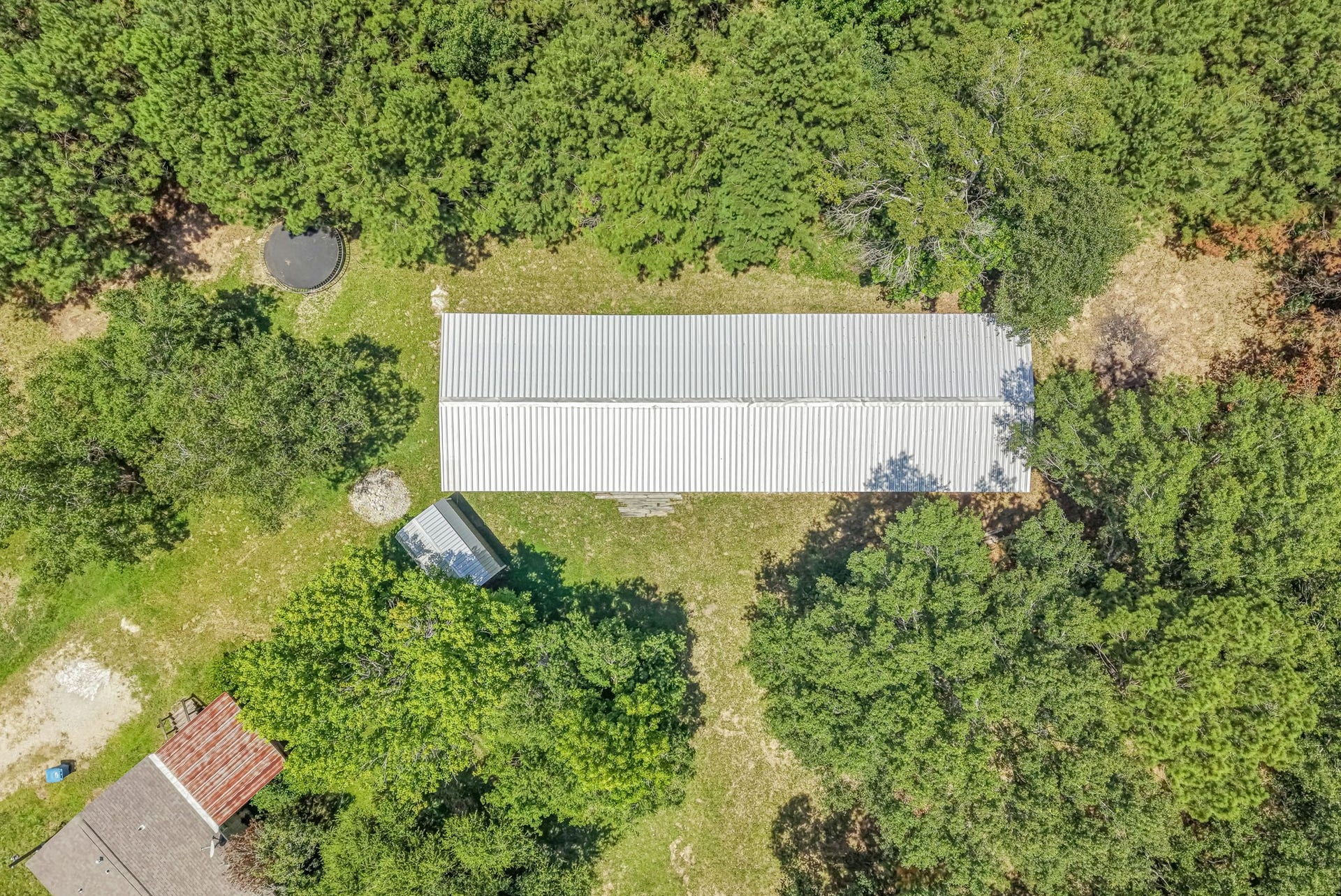 A standout feature of the property, the impressive 30' x 100' metal building offers exceptional versatility - ideal for storage, projects, equipment, recreational vehicles, or endless possibilities.