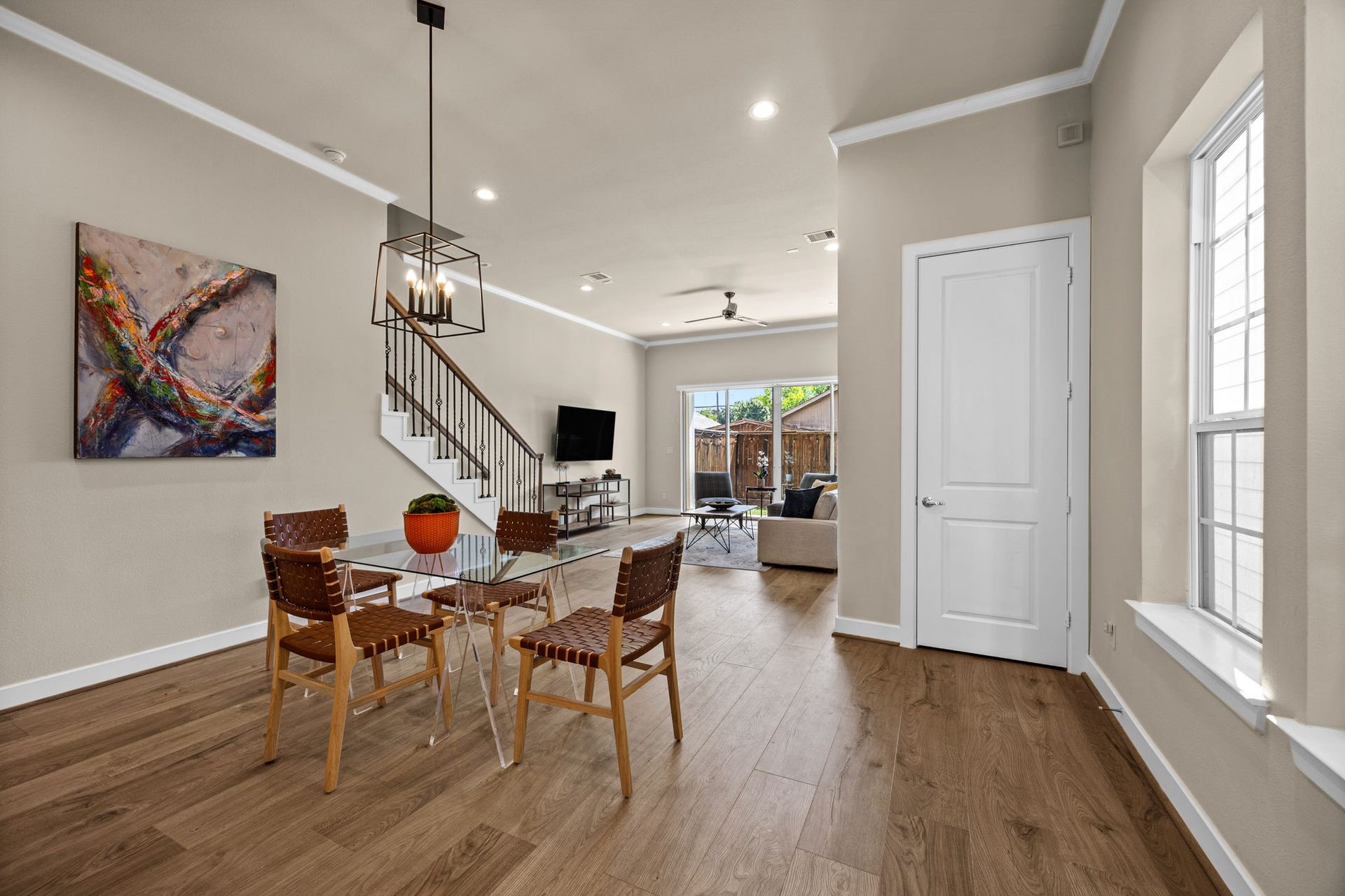 1606 Northwood Street, Houston, TX 77009 Welcome inside. View from the entry highlighting the tall ceilings, spacious engineered flooring and open concept living.