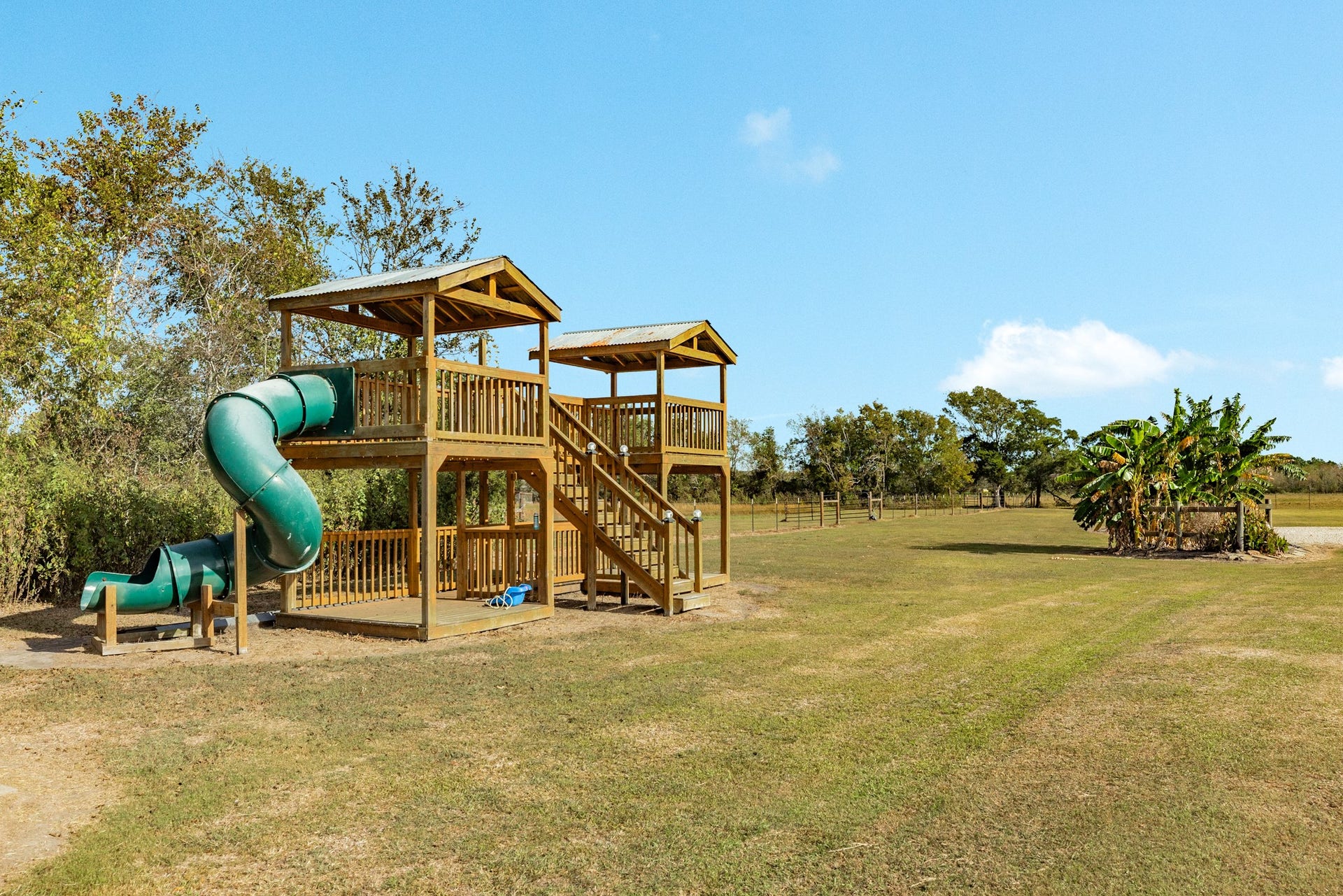9120 County Road 196, Liverpool, TX 77577 Outdoor play area with custom wooden play structure.