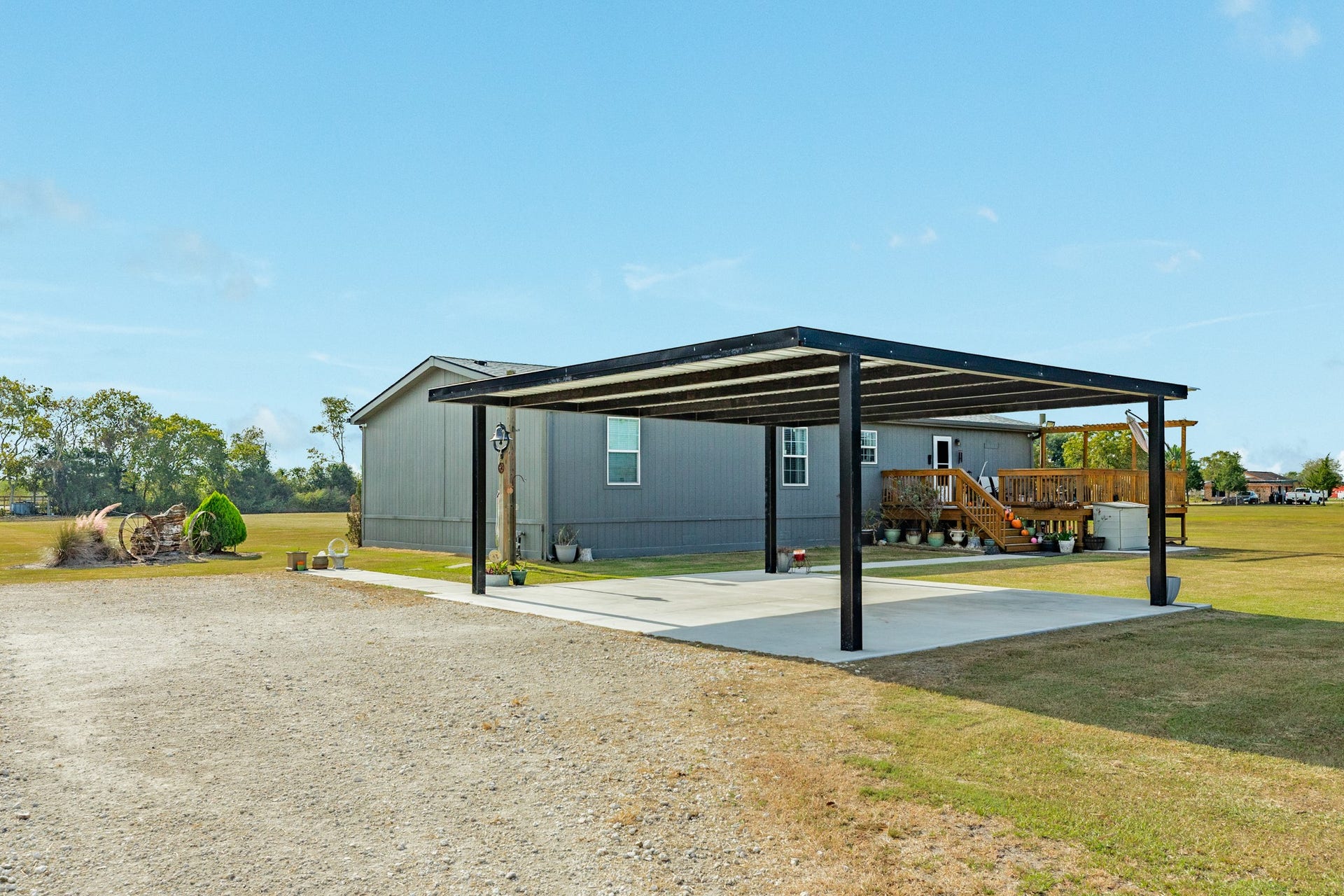 9120 County Road 196, Liverpool, TX 77577 Covered carport with convenient access to the home.