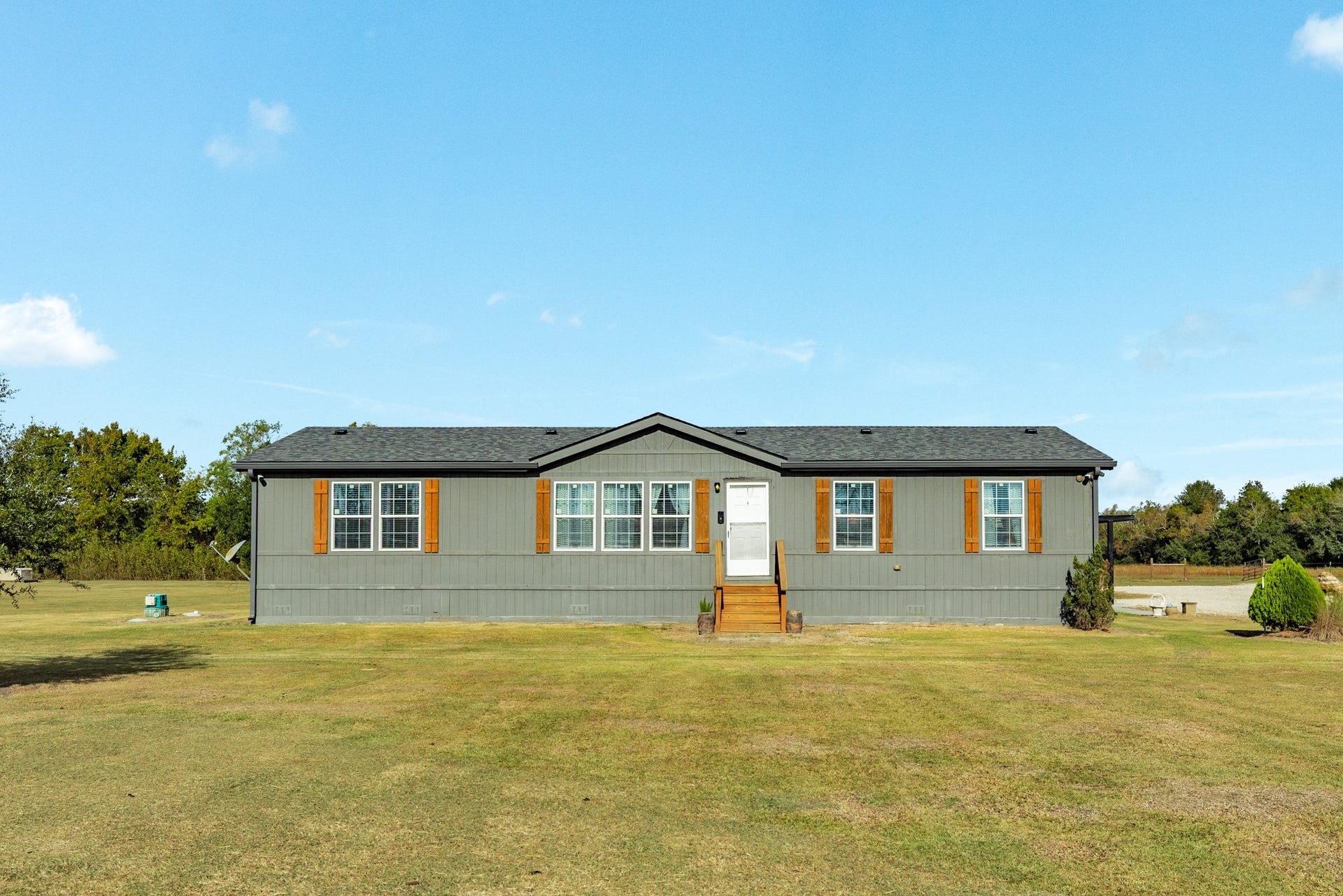 9120 County Road 196, Liverpool, TX 77577 2016 Palm Harbor modular home with 4 bedrooms and 2 bathrooms.
