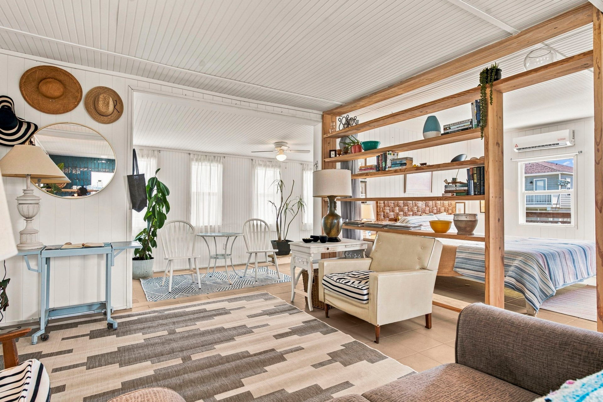 319 Coral Court, Surfside Beach, TX 77541 Welcome to Coconut Cottage. Bright and inviting, this relaxed living space features white paneled walls and ceiling, abundant natural light, and a casual coastal character that feels right at home near the shore.