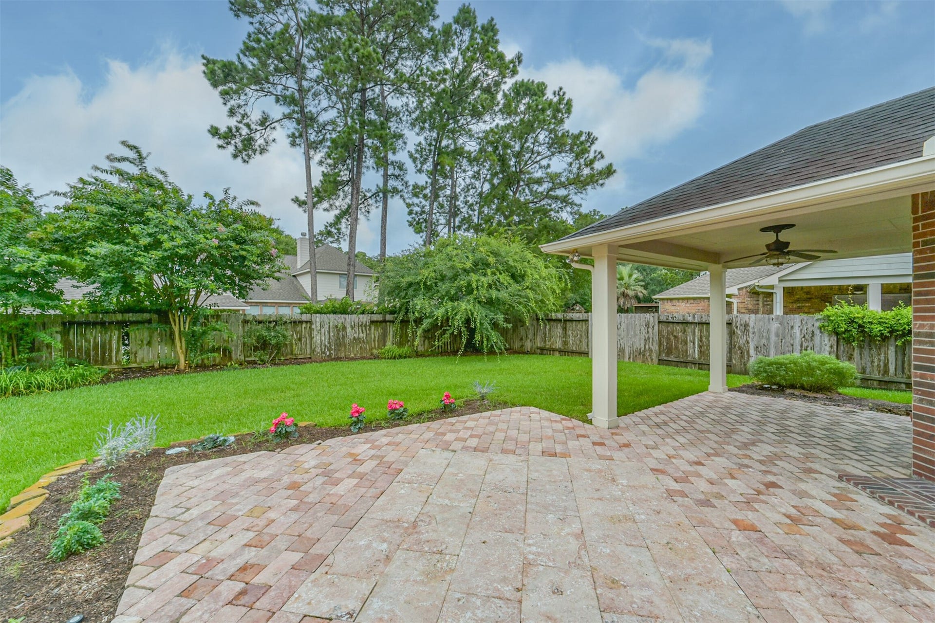 12614 Brazos Bend Trail, Humble, TX 77346 Backyard with plenty of privacy foliage and covered patio