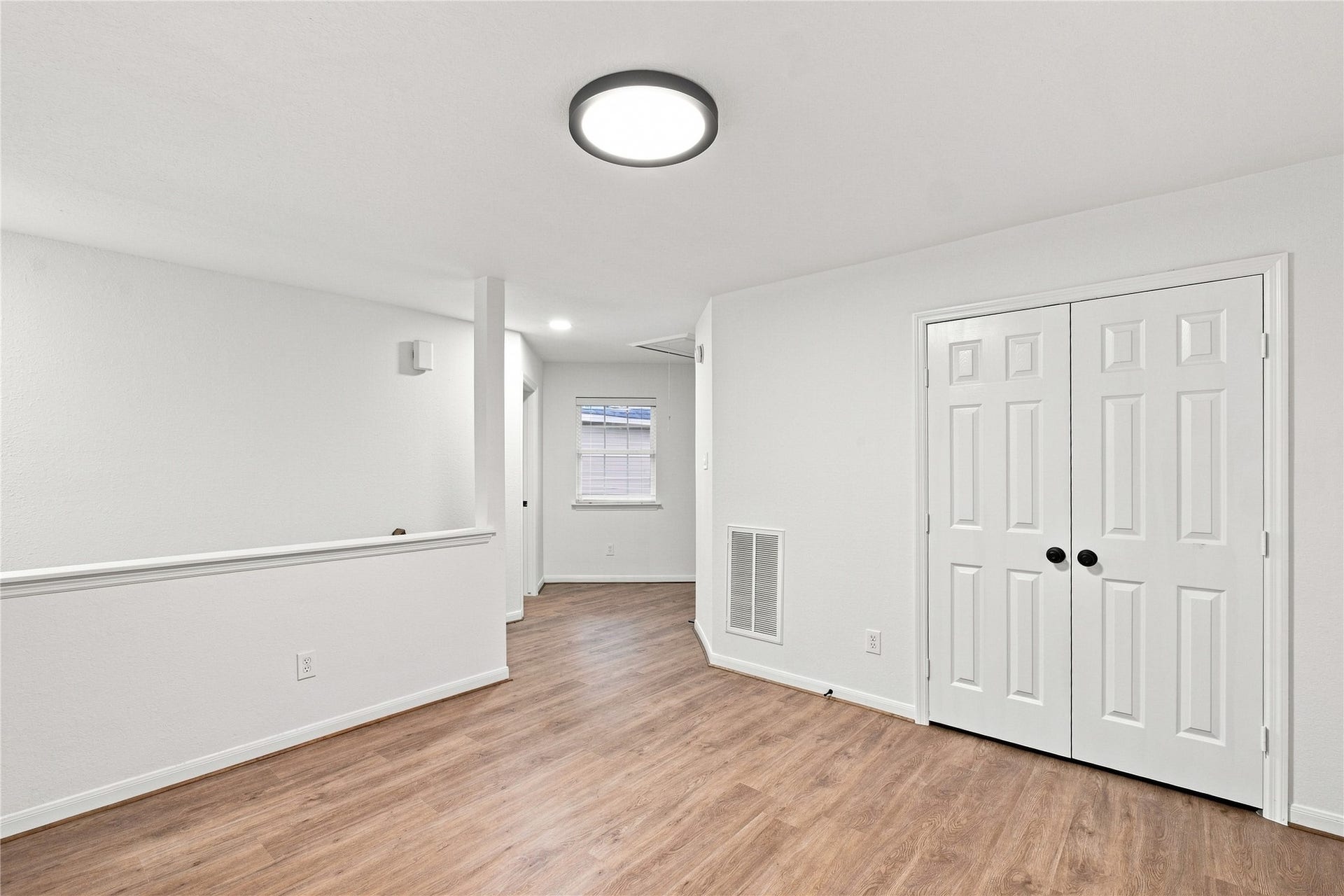 Alternate view of the upstairs loft with large storage closet.