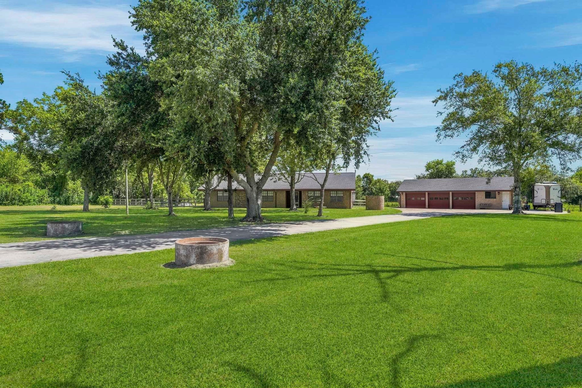 16101 Bluebird Street, Santa Fe, TX 77517 Welcome to 16101 Bluebird St! 1+ acres with an oversized 3 car garage greets you home! Expansive green lawn leads to a charming home shaded by mature trees, perfect for serene living.