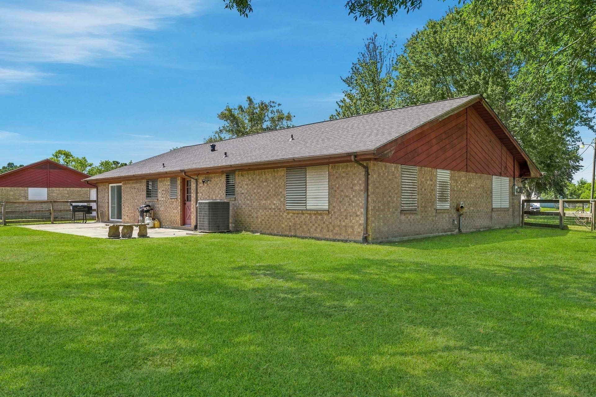 16101 Bluebird Street, Santa Fe, TX 77517 Charming brick home with a spacious backyard, perfect for outdoor gatherings and relaxation.