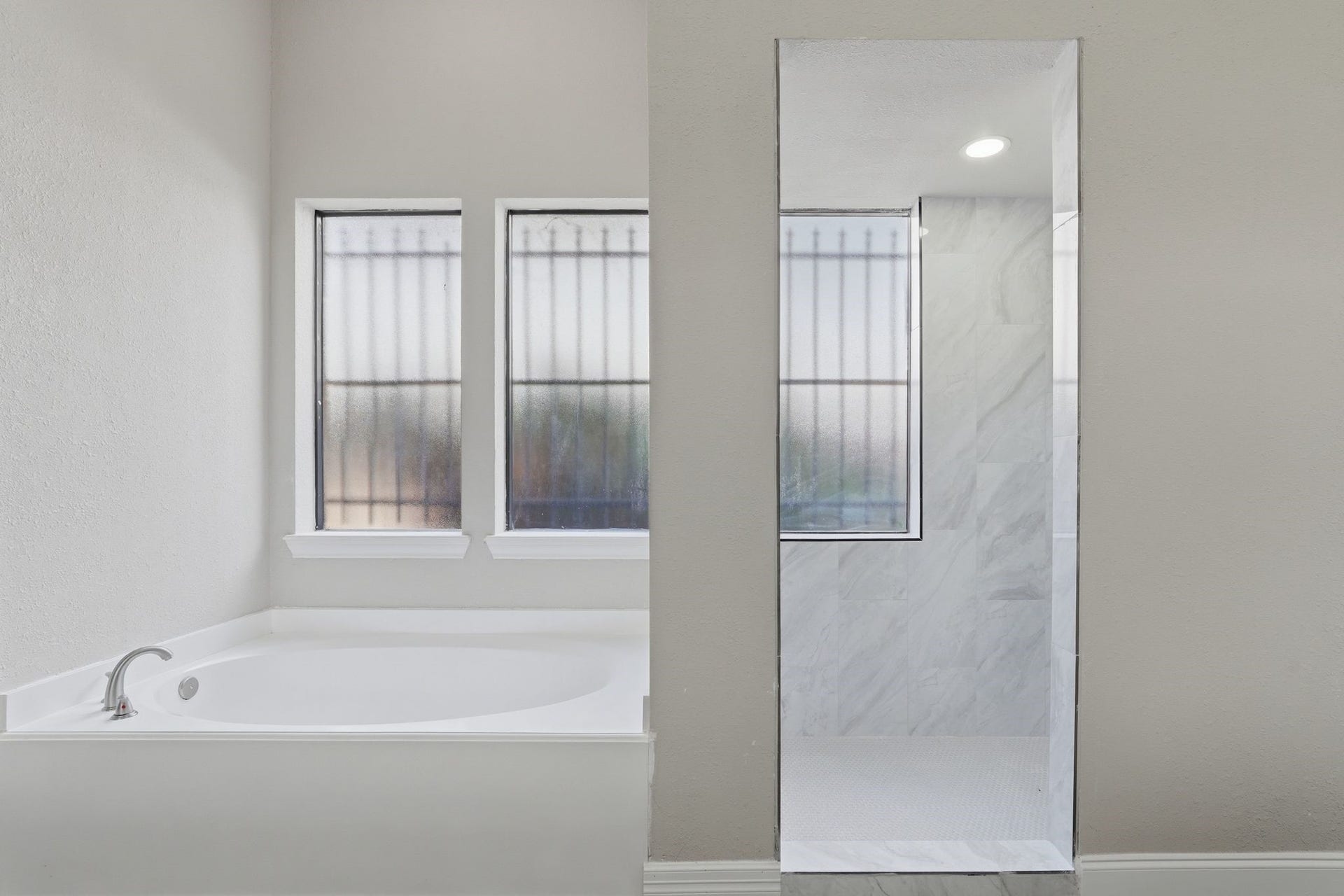 Soaker Tub and entrance to your shower!