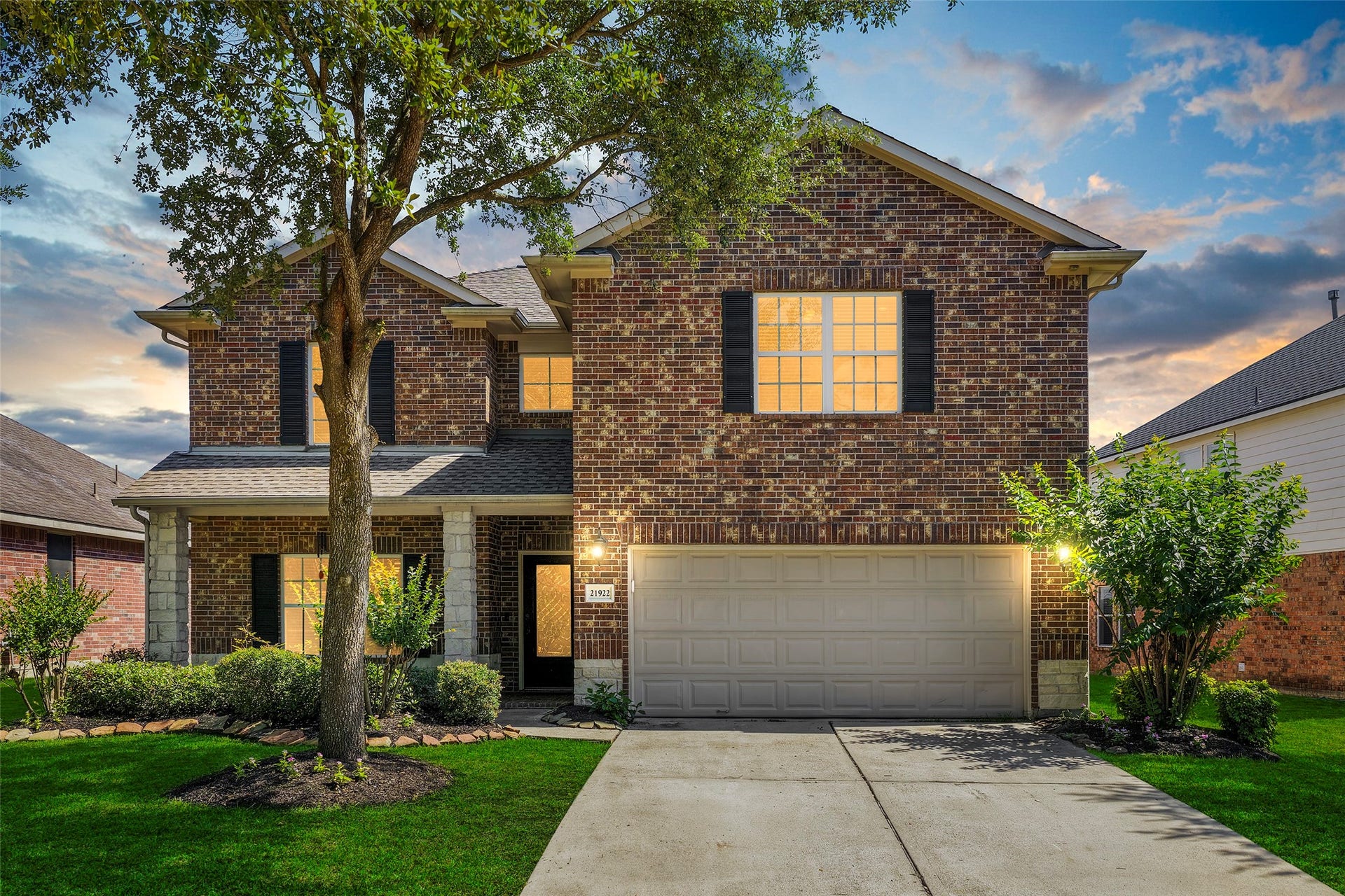 21922 Field Green Drive, Cypress, TX 77433 Stunning two-story brick exterior with mature oak trees, manicured landscaping, and charming curb appeal tucked away on a quiet street in Fairfield Village South - Summer Crossing section.