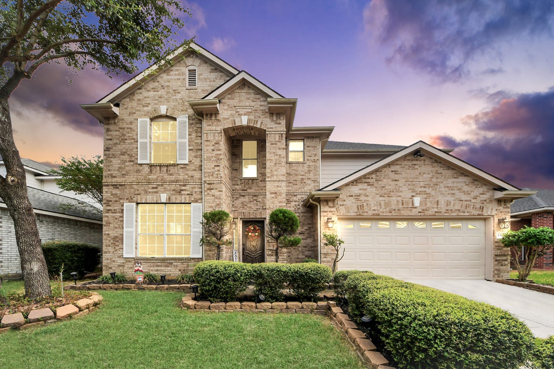 The home makes a strong first impression with its impressive brick entry and inviting curb appeal.