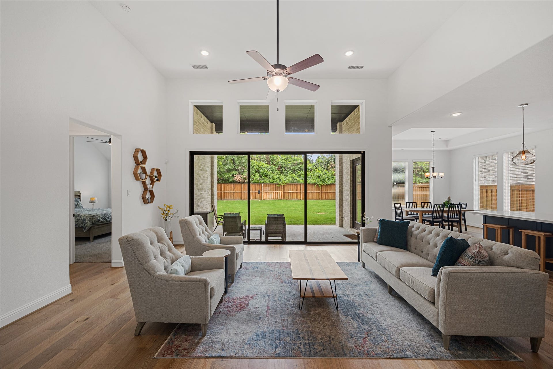 Living room area with stackable sliding doors.