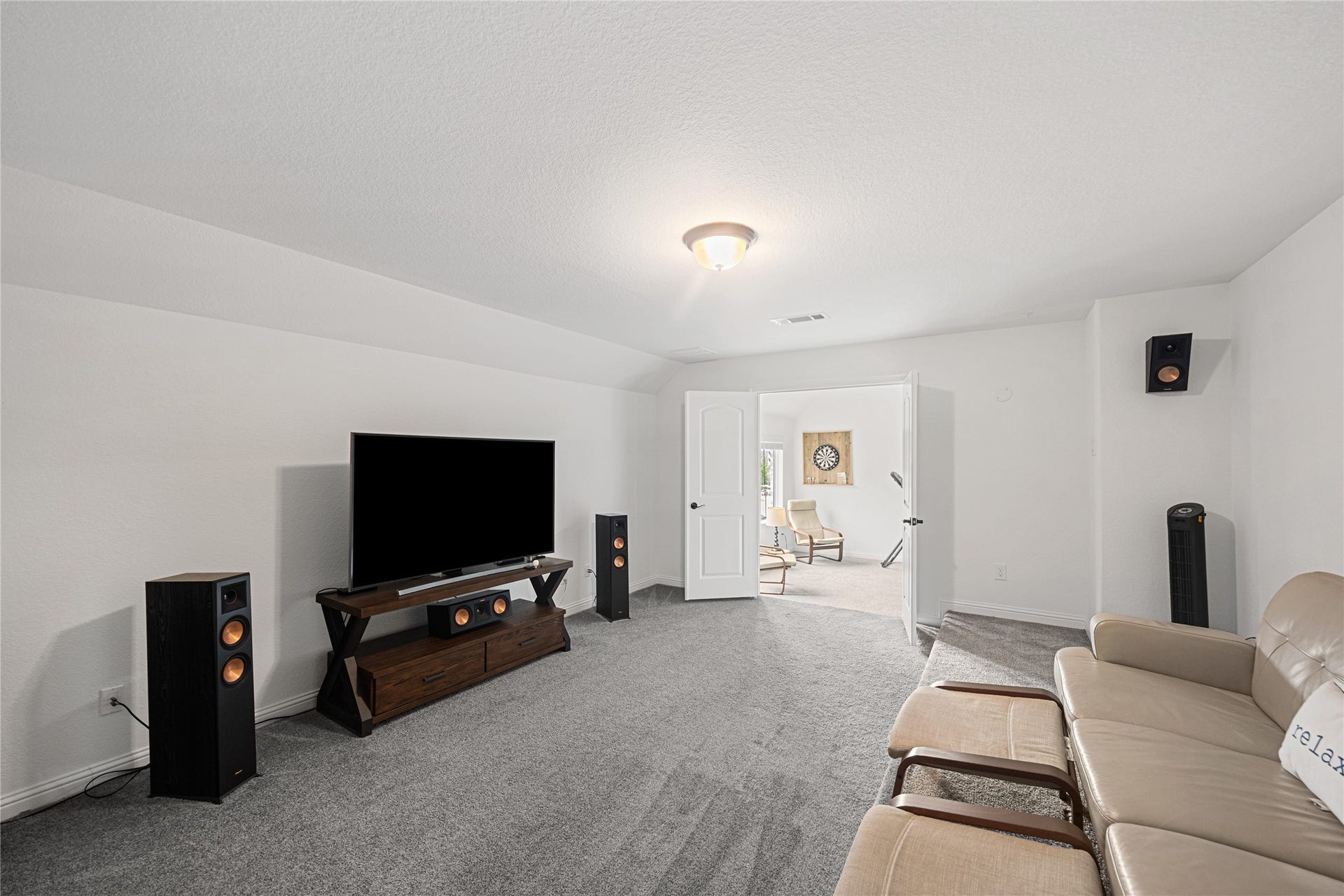 Perfect space to watch a movie or catch a game in the media room.