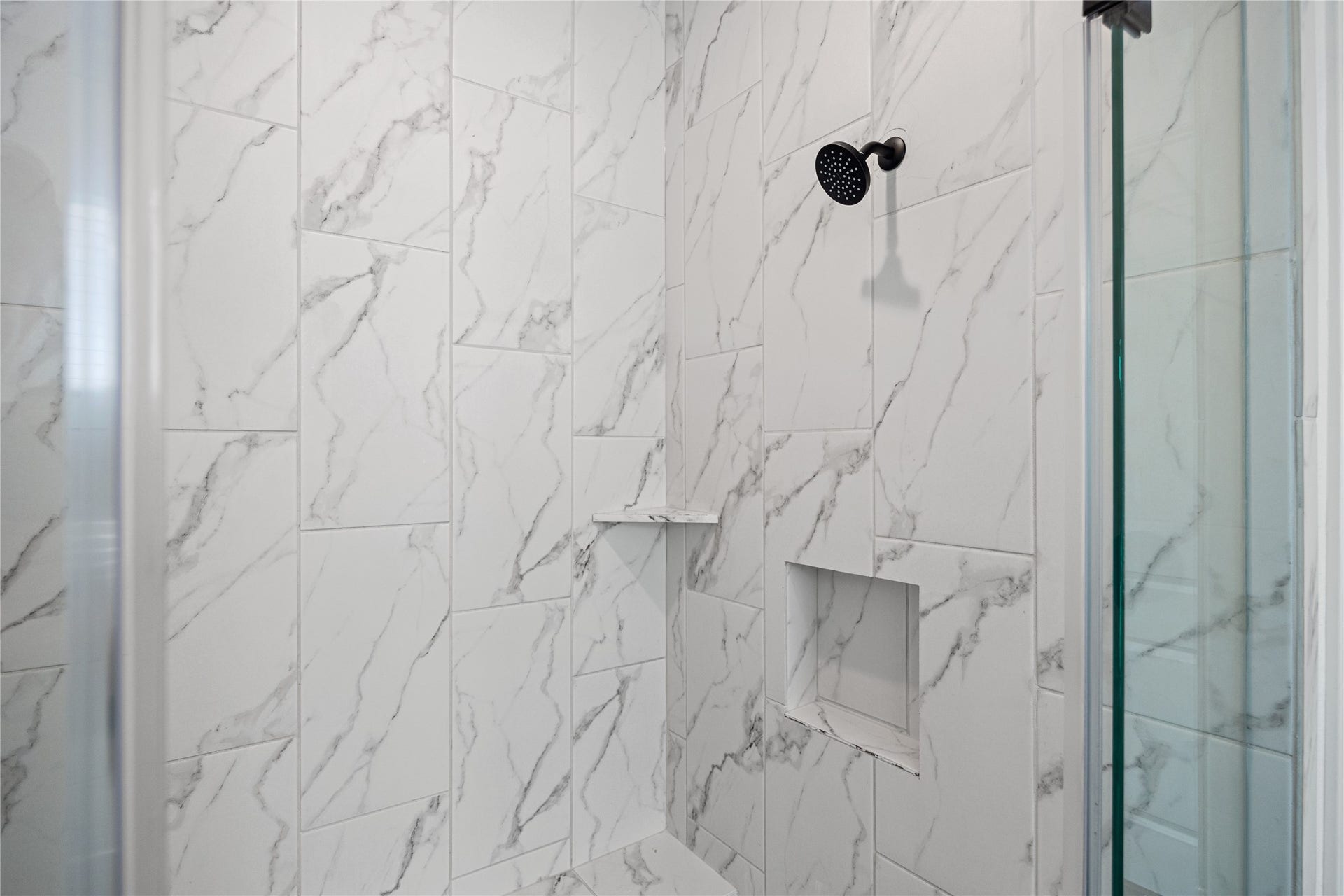 Walk-in shower in the primary bathroom.