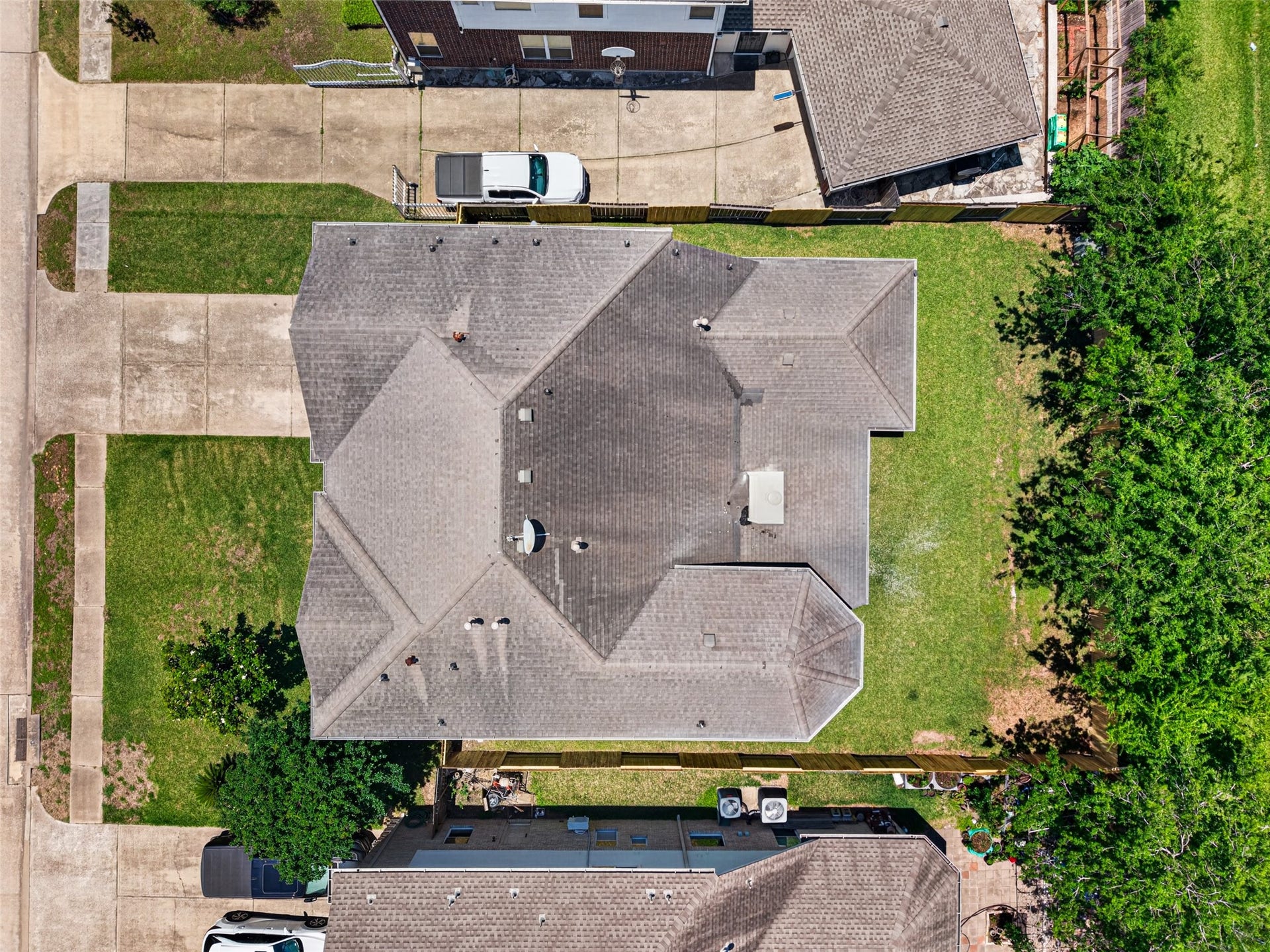 13910 Sunset View Drive, Houston, TX 77083 From this aerial perspective, you can see the expansive green space and the property's generous proportions, highlighting its prime position within this quiet, established community.