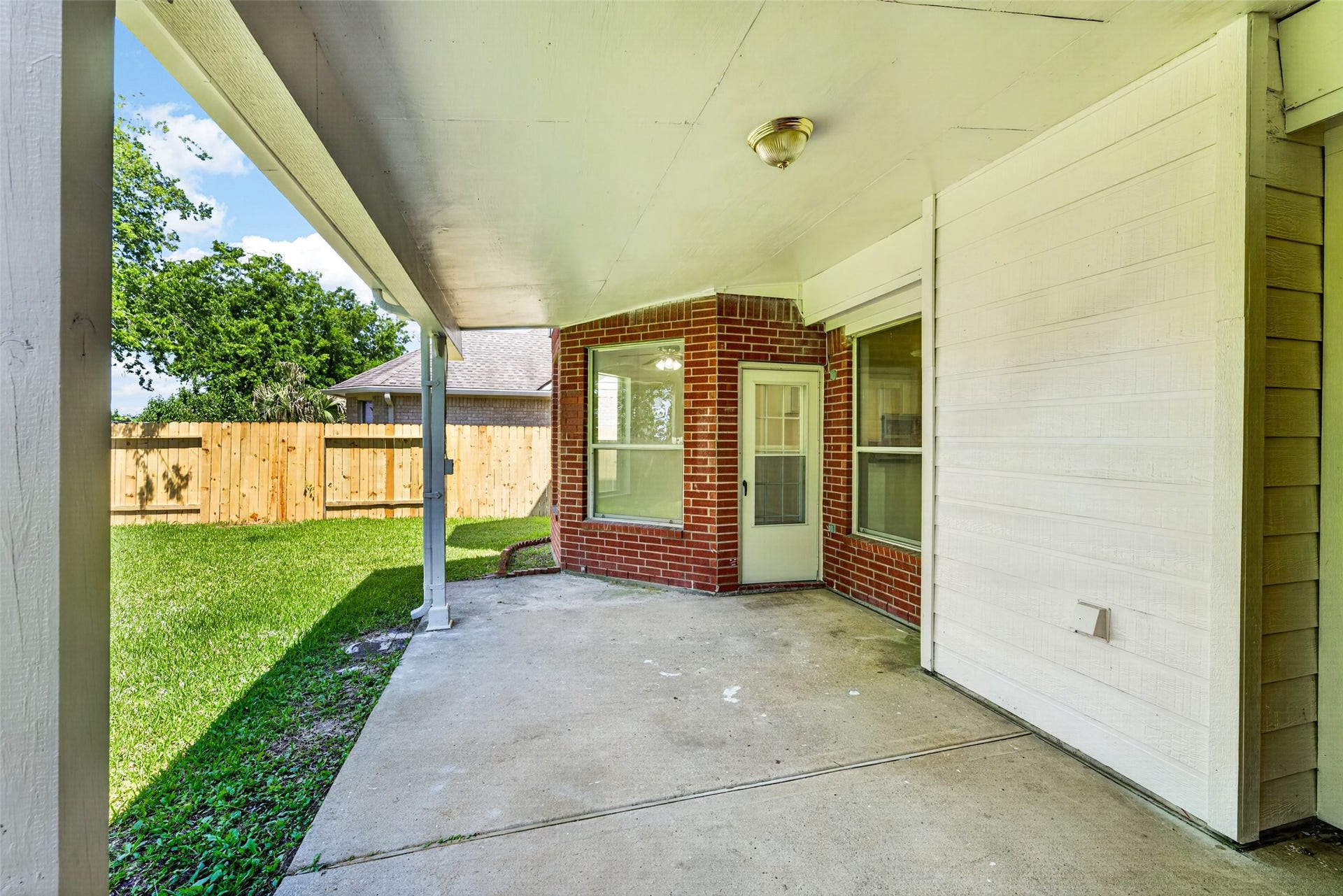 13910 Sunset View Drive, Houston, TX 77083 Step out onto the spacious covered patio, an ideal spot for outdoor lounging or dining while enjoying the privacy of a backyard with no back neighbors.