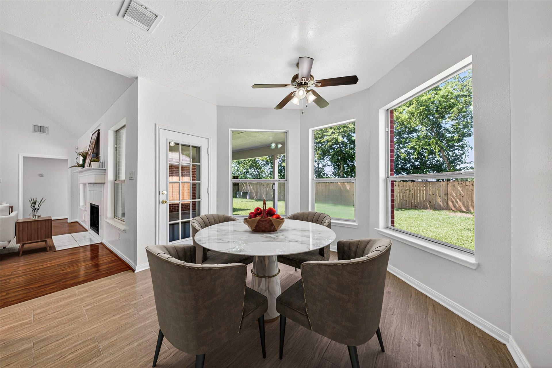 13910 Sunset View Drive, Houston, TX 77083 This cheerful space features a charming bay window design and a stylish ceiling fan, creating a comfortable spot for casual meals or your morning coffee.