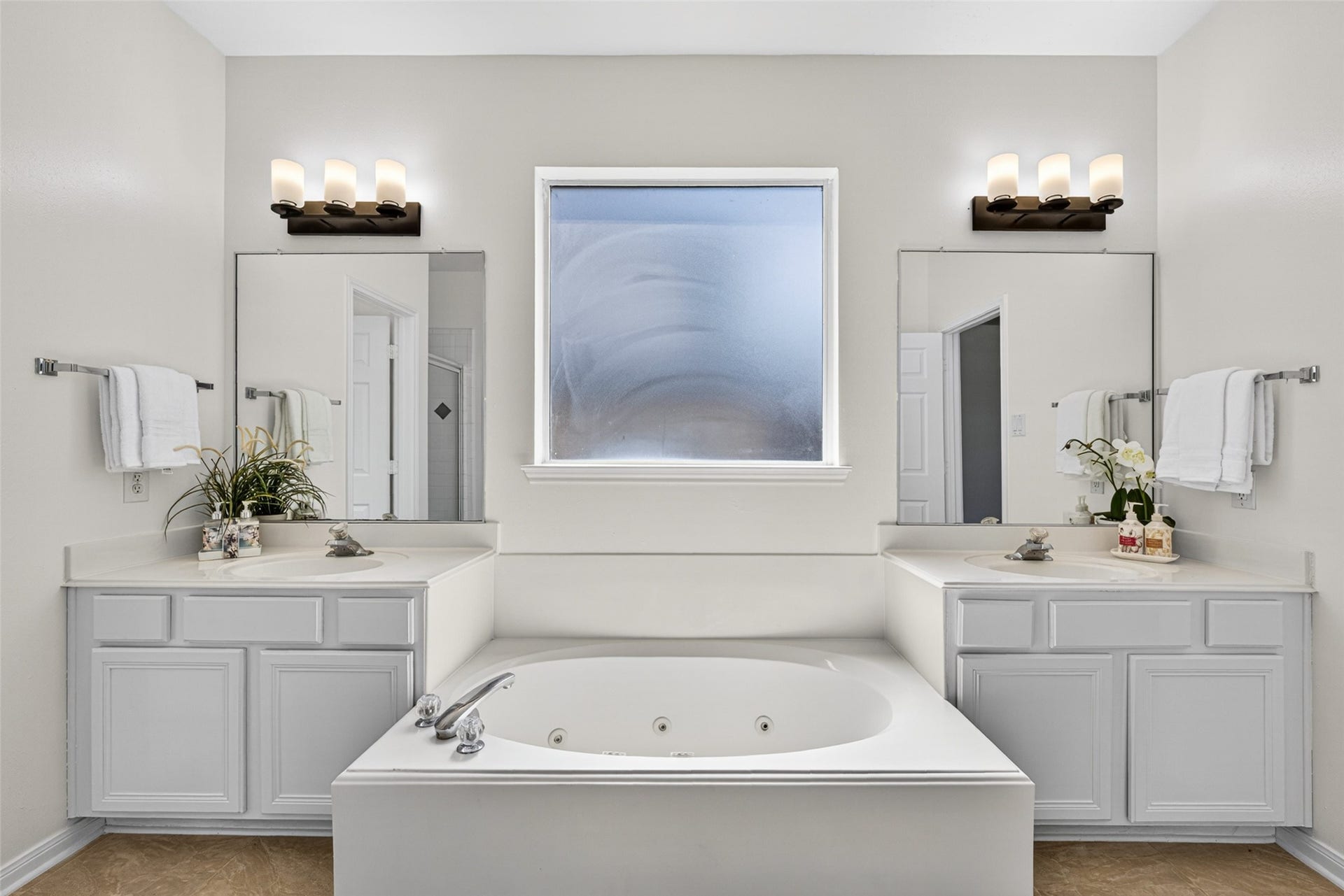 13910 Sunset View Drive, Houston, TX 77083 It features an en suite bathroom complete with a relaxing garden tub and a dual vanity for morning convenience.