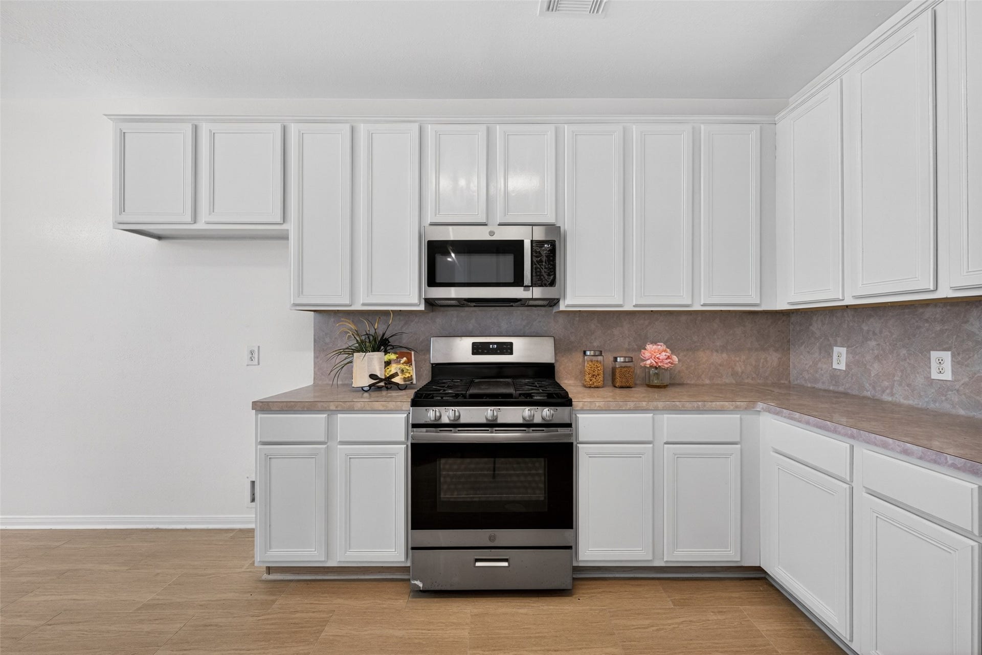 13910 Sunset View Drive, Houston, TX 77083 It comes fully equipped with modern stainless steel appliances and connects directly to a charming breakfast area.