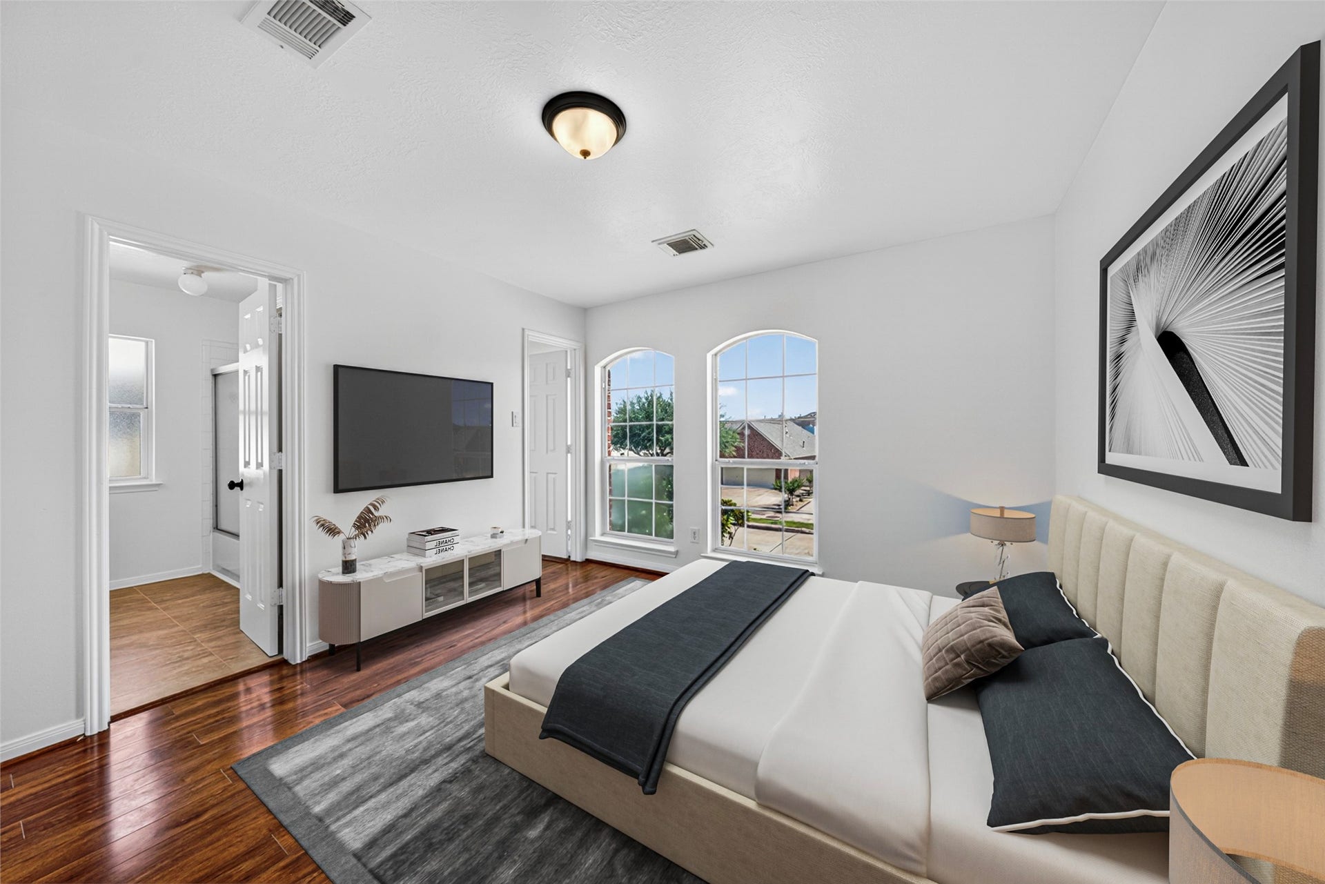 13910 Sunset View Drive, Houston, TX 77083 This charming third bedroom radiates an uplifting energy, with its unique arched windows flooding the space in soft, natural light.
