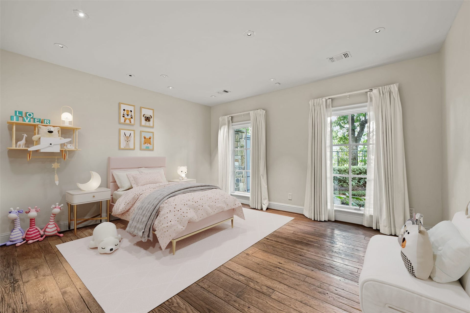 1 Gage Court, Houston, TX 77024 Another secondary bedroom features hand-scraped French white oak flooring and multiple windows bringing in abundant natural light. Its private setting and en-suite bath continue the thoughtful layout of the bedroom wing. (digitally staged)