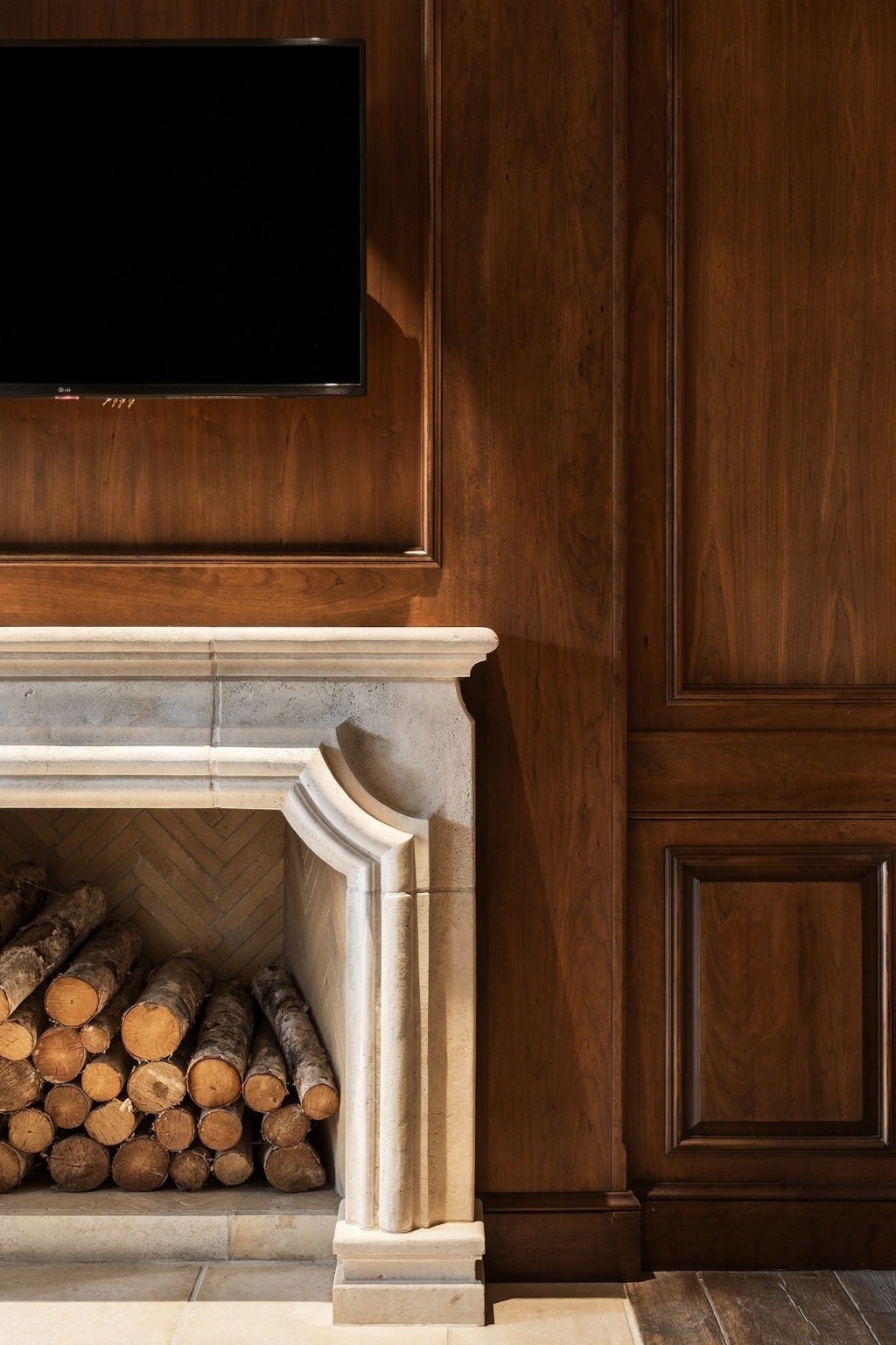 1 Gage Court, Houston, TX 77024 Framed by rich wood paneling and custom cabinetry, the library fireplace brings a quieter, more collected sense of craftsmanship to the room. Its special-order stone was sourced from the same quarry Michelangelo used for some of his work, adding a rare architectural story to one of the homes most intimate spaces.