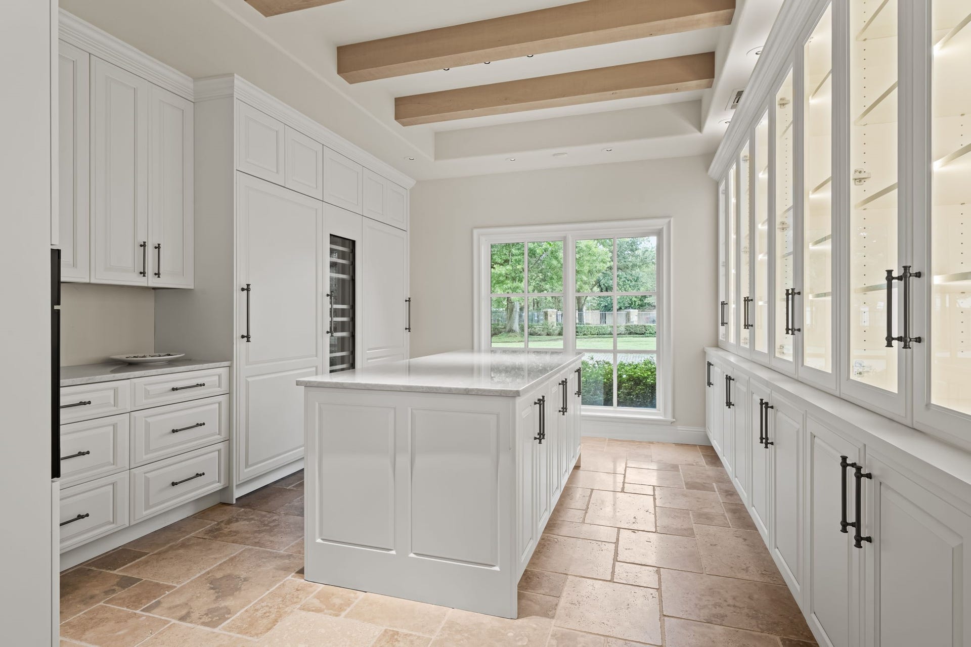 1 Gage Court, Houston, TX 77024 The butlers pantry offers a second fully equipped workspace with Wood-Mode cabinetry, its own center island and a built-in Miele coffee system. It provides a dedicated area for preparation and service away from the main kitchen.