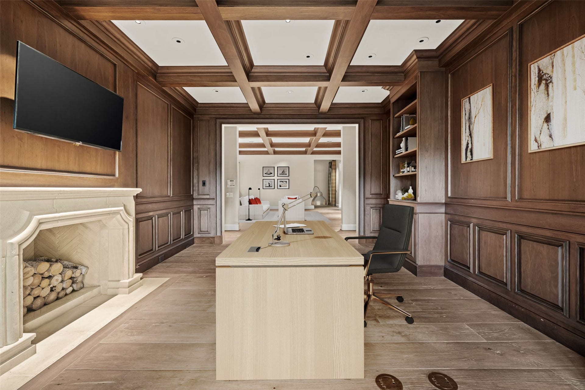 1 Gage Court, Houston, TX 77024 Another view of the library highlights the extensive millwork, built-in cabinetry and long sightline through the room. The combination of paneled walls, patterned oak flooring and natural light gives the space a warm, collected feel. (digitally staged)