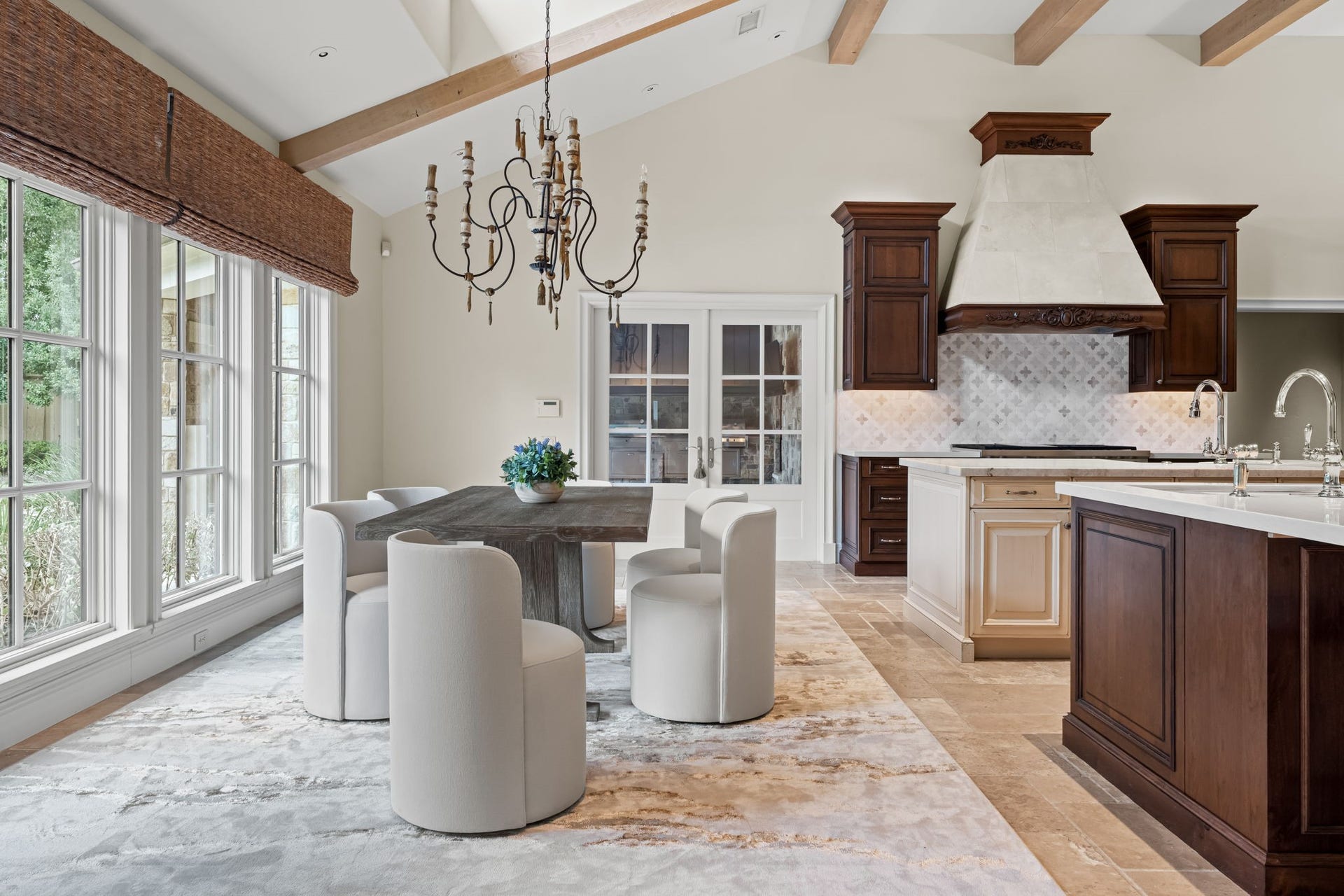 1 Gage Court, Houston, TX 77024 The kitchen transitions naturally into an informal dining area positioned beside the windows. Its placement keeps everyday dining connected to both the kitchen and the homes main entertaining spaces.