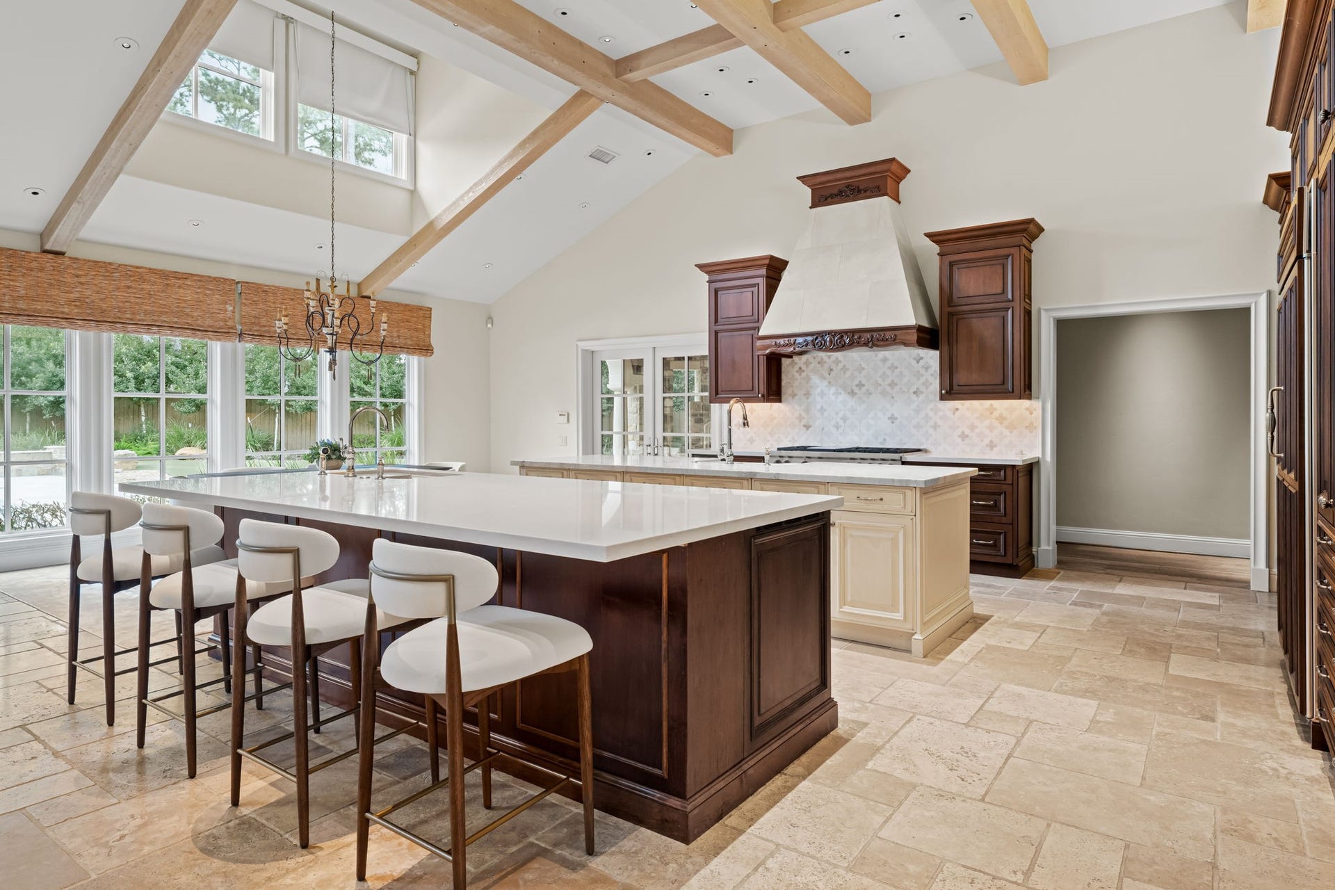 1 Gage Court, Houston, TX 77024 A second island adds prep and serving space while keeping the kitchen open to the great room. The kitchen is equipped with Sub-Zero refrigerator and freezer columns, a Wolf eight-burner gas range, double ovens, two KitchenAid dishwashers, a Wolf convection oven and warming drawer, Sub-Zero beverage refrigeration and a U-Line ice maker.