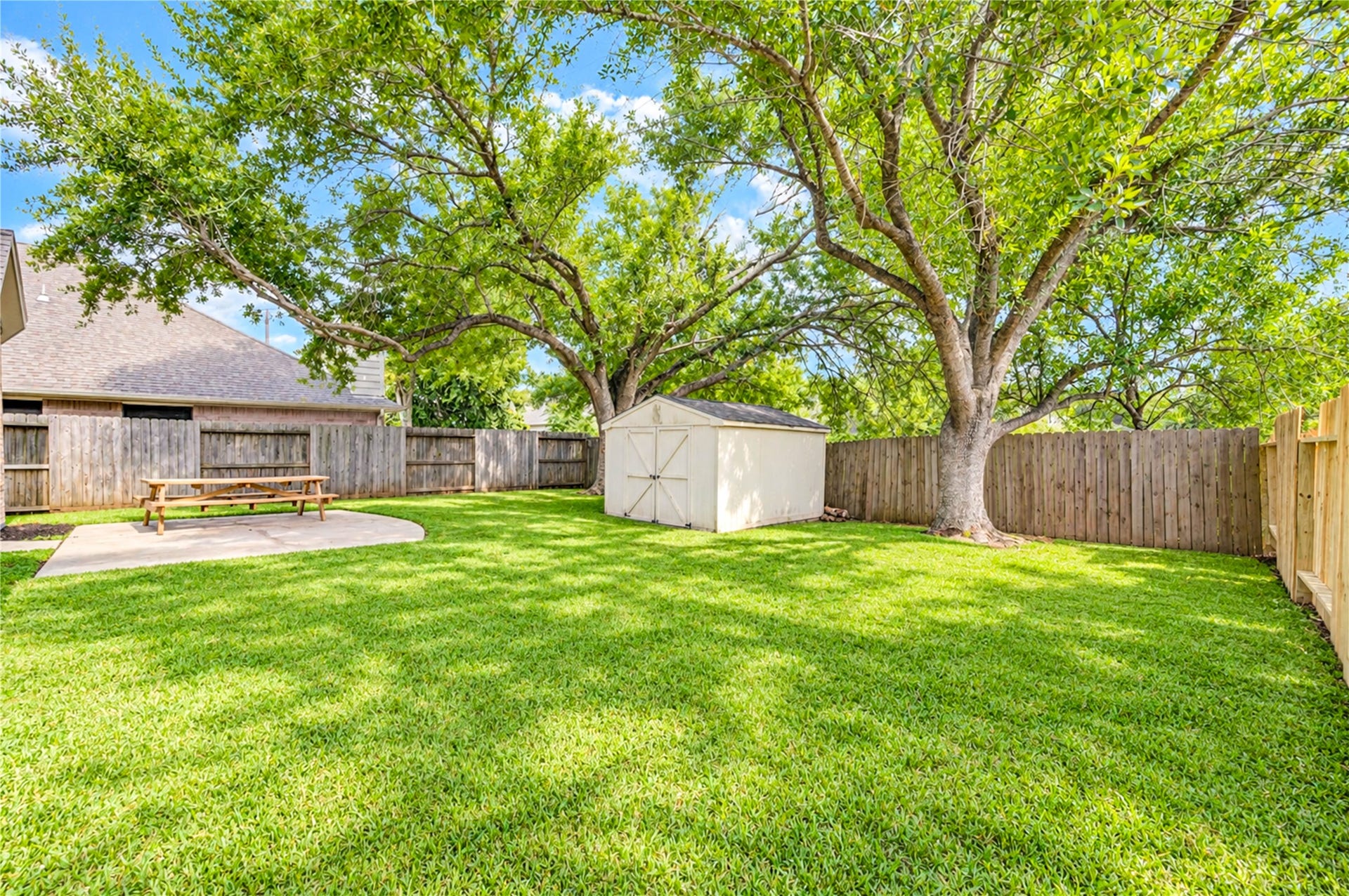 3835 Heritage Colony Drive, Missouri City, TX 77459 Backyard has a patio, storage shed, and partial new fence