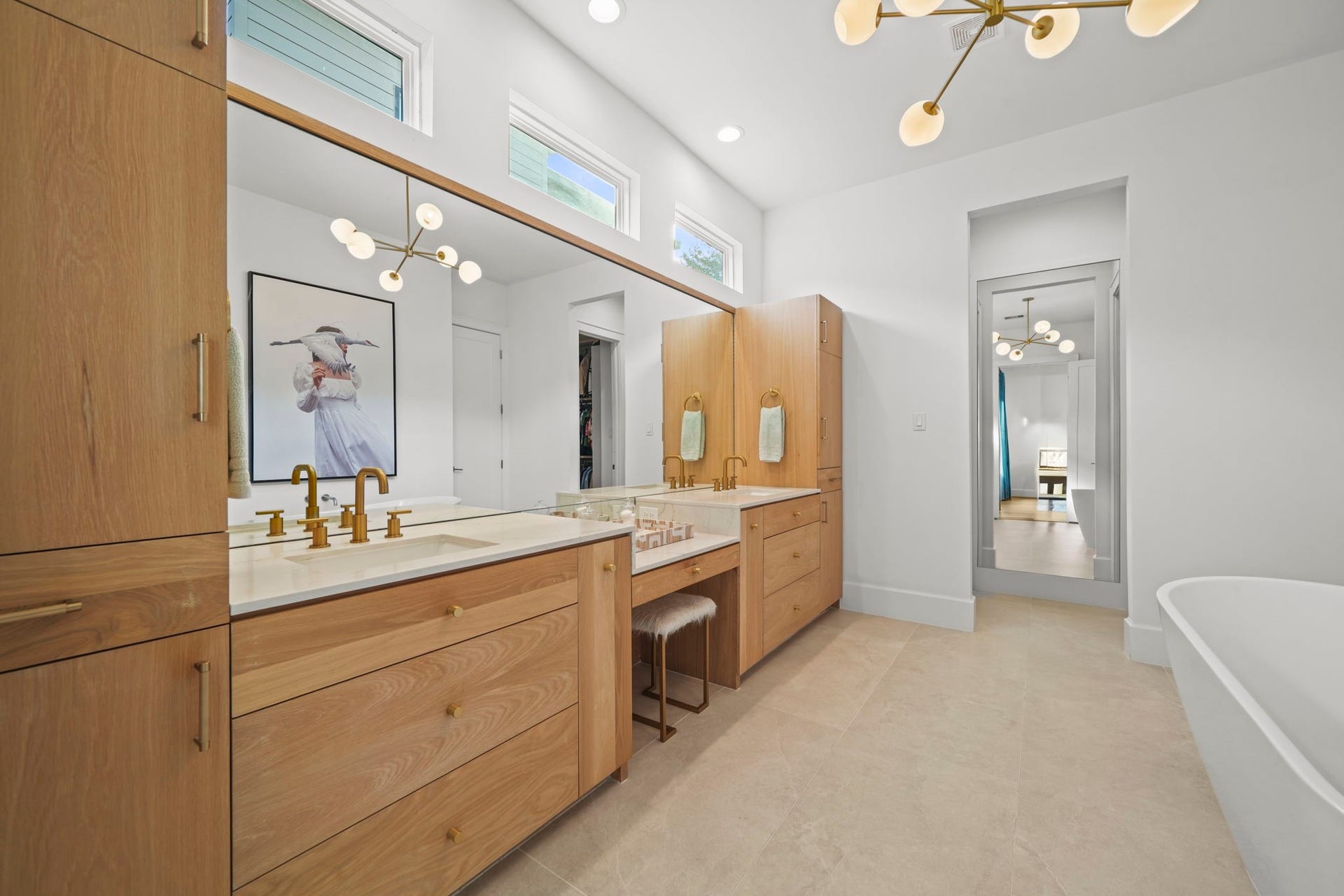 6425 Remlap Street, Houston, TX 77055 The primary bathroom is stunning! Gold finishes, windows and a full length mirror add to the custom touches!