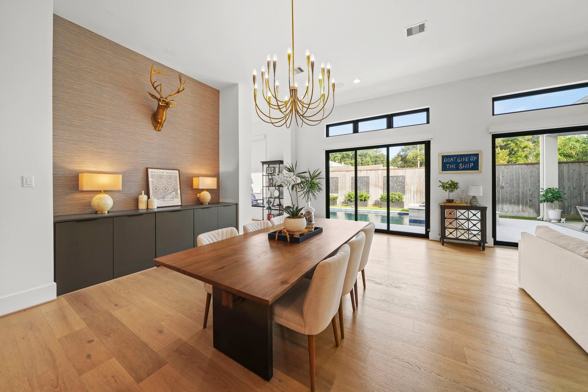 6425 Remlap Street, Houston, TX 77055 The dining room is complete with a built in buffet, custom chandelier and is open to the family room and the backyard!