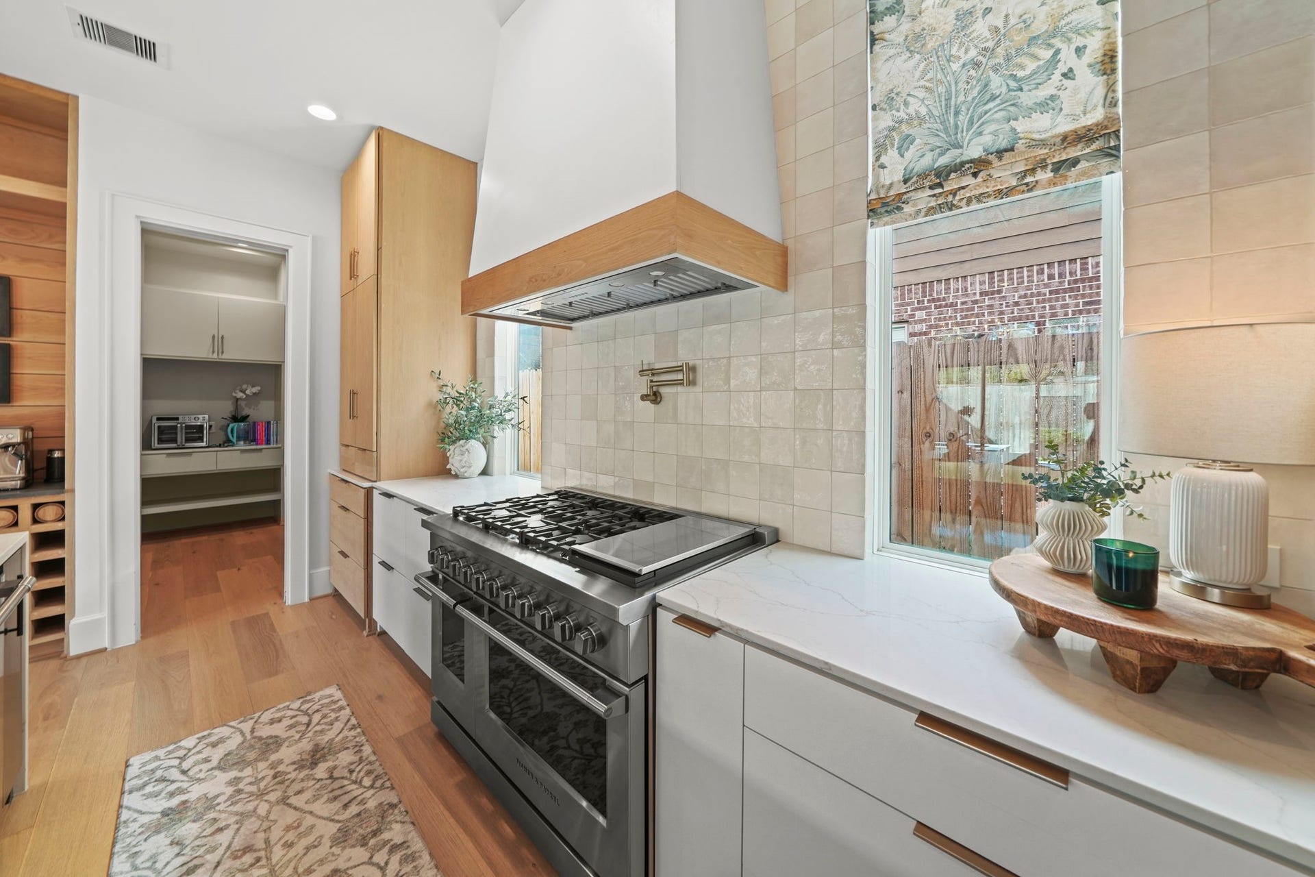6425 Remlap Street, Houston, TX 77055 Gorgeous stove/oven and windows provide light into the kitchen!