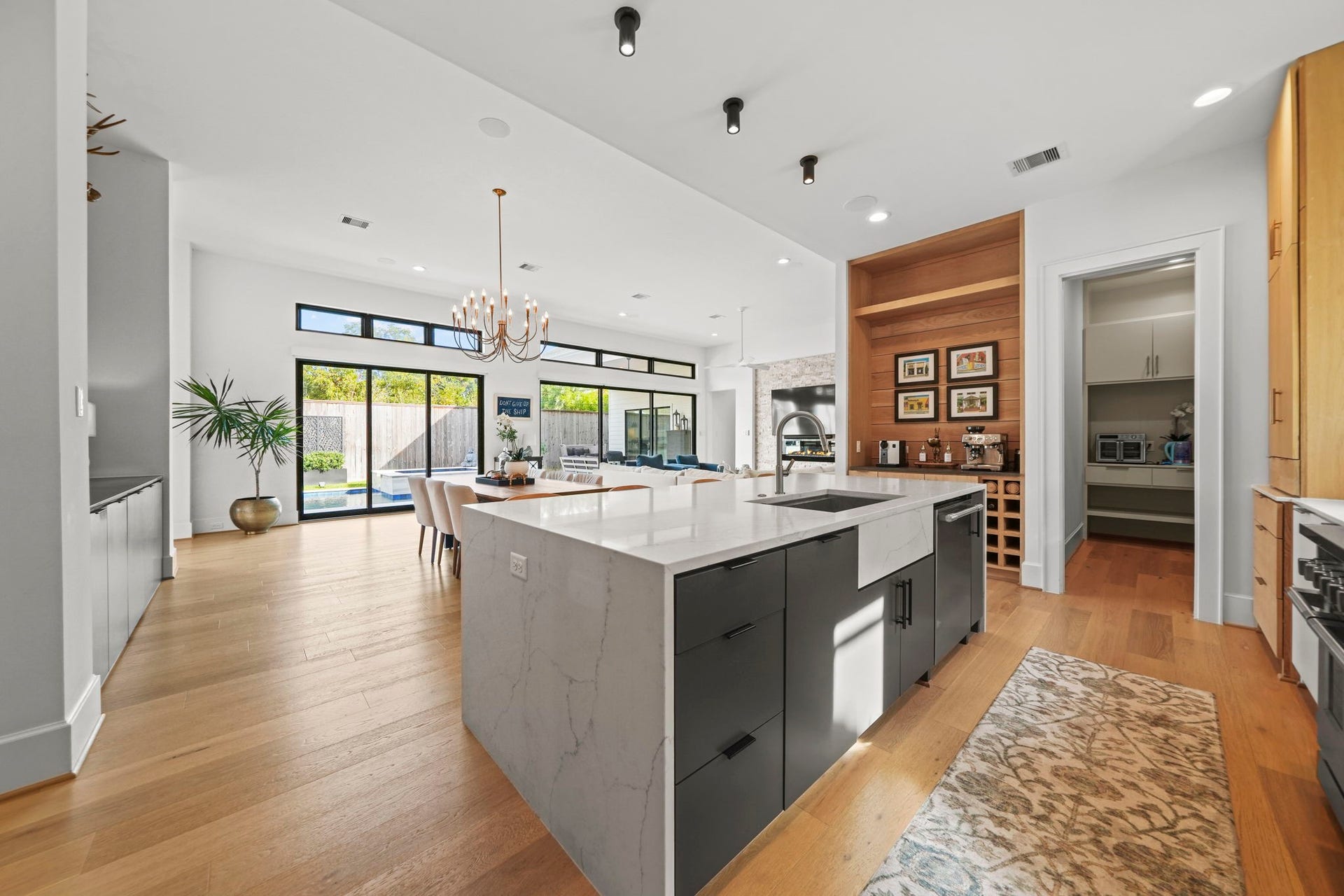 6425 Remlap Street, Houston, TX 77055 The kitchen is open to the dining area and large living space with sliding doors out to the pool!