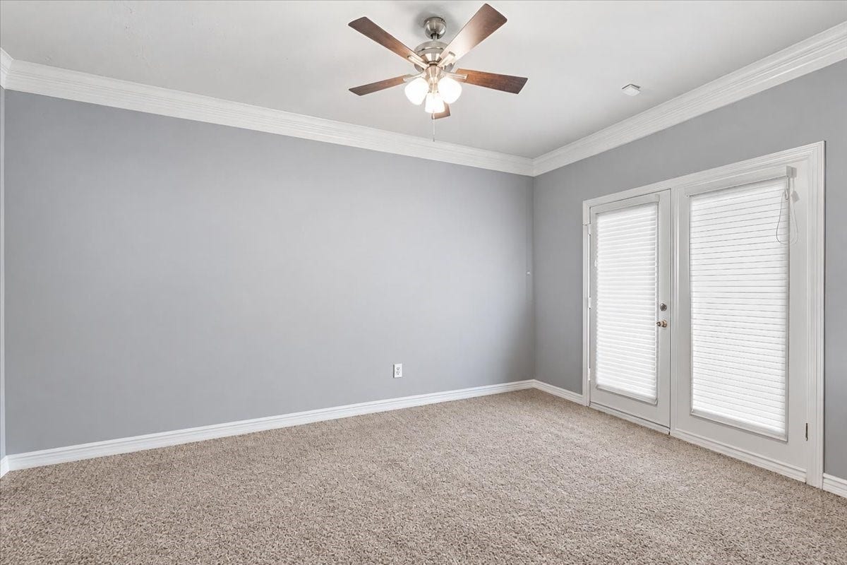 3326 Desert Inn Drive, Montgomery, TX 77356 Primary bedroom has french doors leading to the covered patio to enjoy your morning coffee
