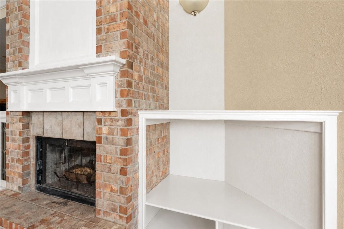 3326 Desert Inn Drive, Montgomery, TX 77356 Stunning brick fireplace with built ins