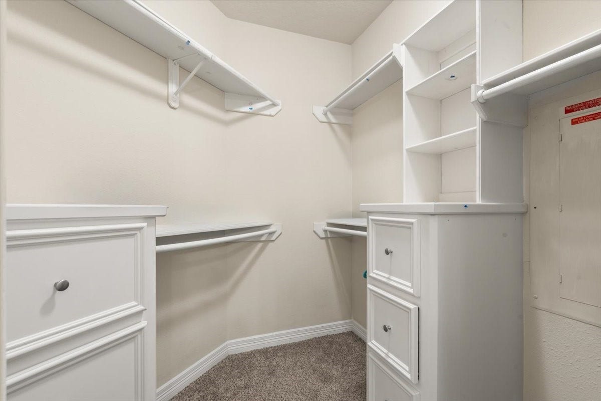 3326 Desert Inn Drive, Montgomery, TX 77356 Primary closet with built in drawers and cabinets