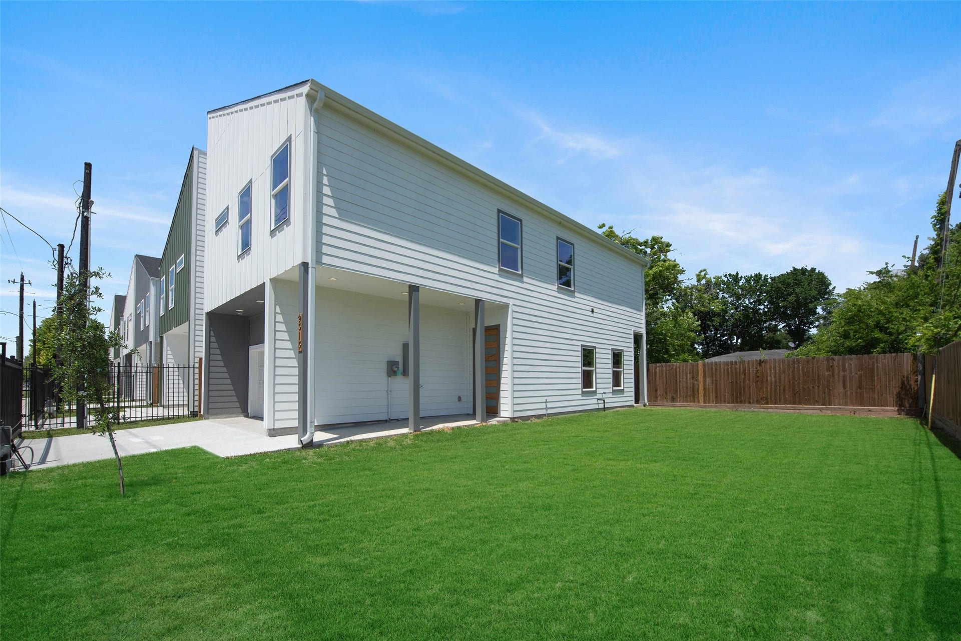 A large backyard offers plenty of space for BBQs, play, and outdoor entertaining.