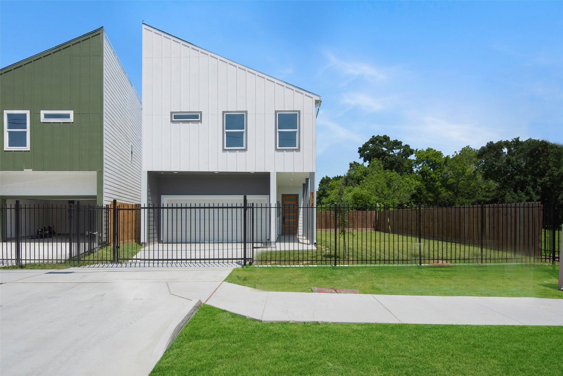 This inviting front elevation features automatic gates, a fully fenced side yard, and a private driveway leading to a convenient two-car attached garage. Enjoy added privacy, security, and easy access in this beautifully maintained exterior.