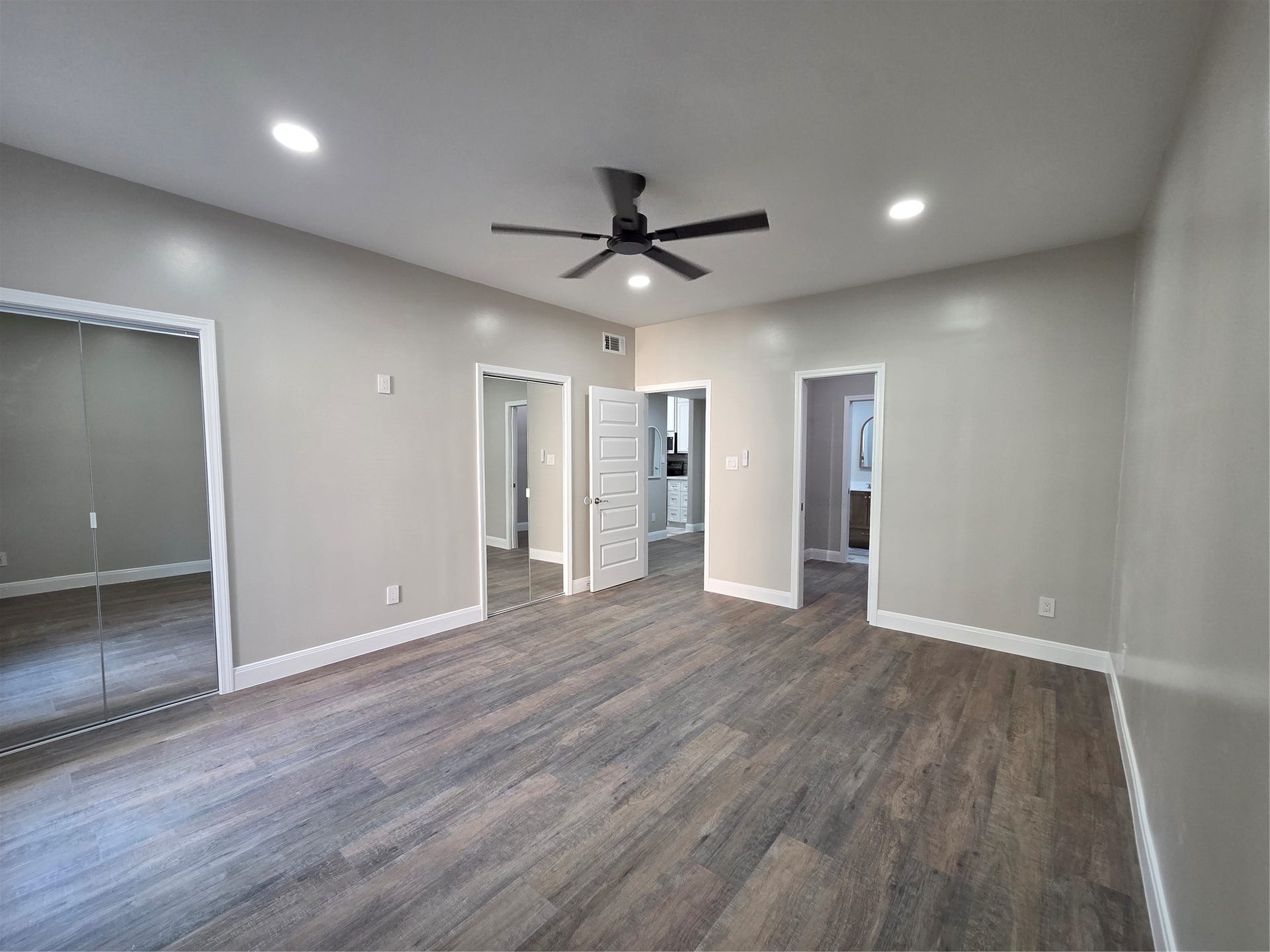 2475 Underwood Street, #166, Houston, TX 77030 Primary offers dual walkin mirror door closets with recess lighting, celing fan, 5 inch baseboards and usb outlets where needed