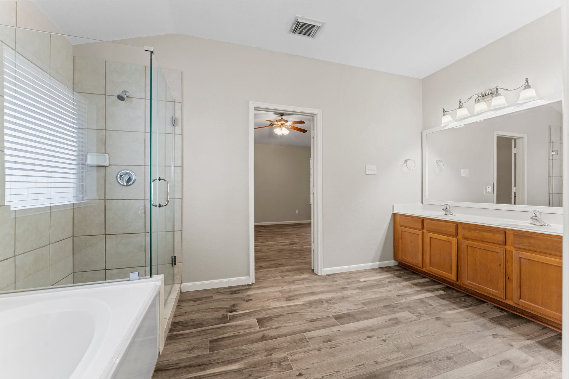 34 Bryce Branch Circle, The Woodlands, TX 77382 The soaker tub is ideal for relaxing, and the large tiled shower is perfect for an invigorating wake-up in the morning. Large sunny window for natural light! New frameless shower enclosure.