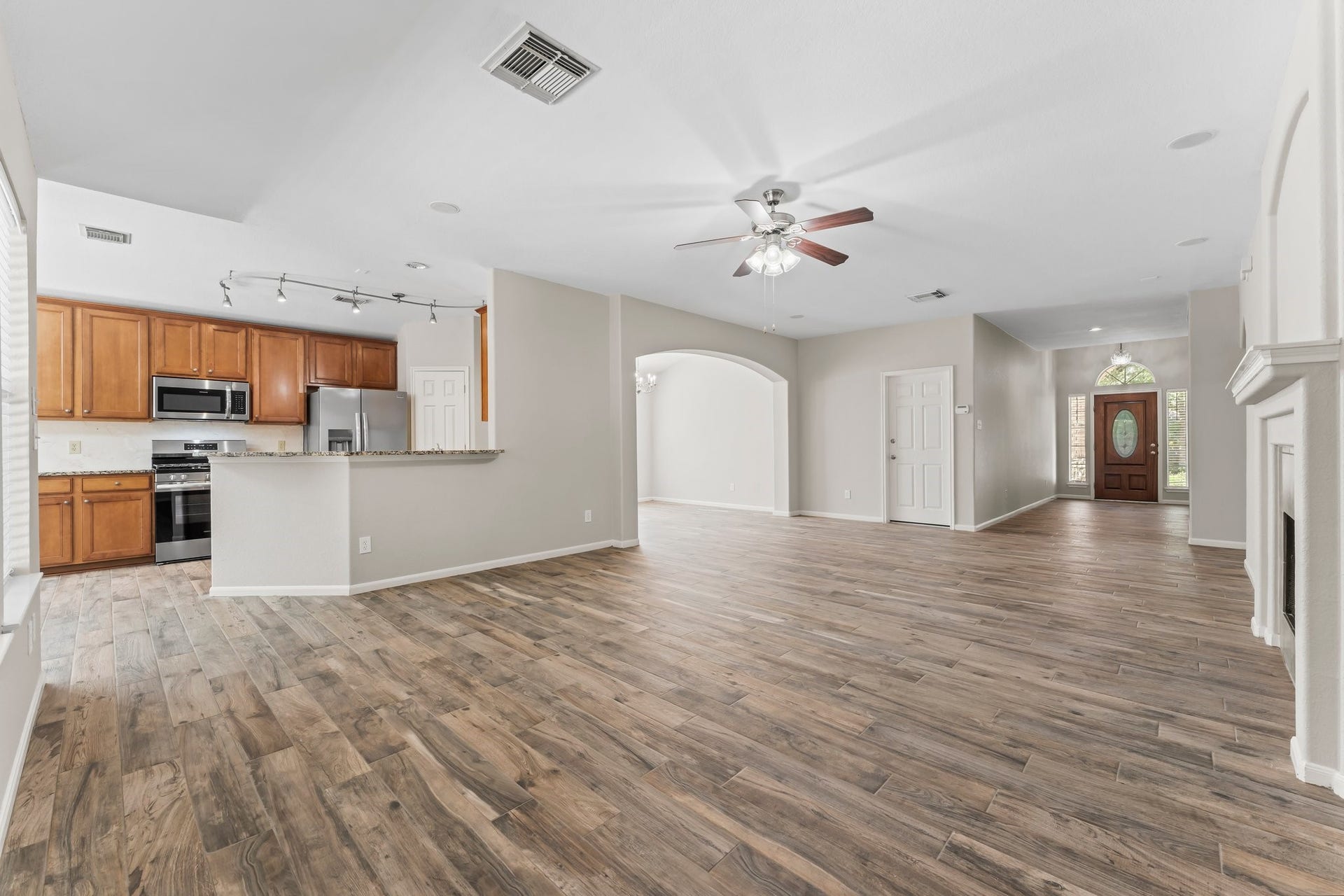 34 Bryce Branch Circle, The Woodlands, TX 77382 Great view of this home's elegance looking toward the kitchen and Foyer. Kitchen is open to the Family room so it's easy to interact with family while preparing dinner!