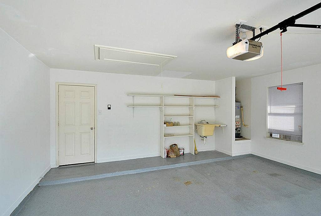 34 Bryce Branch Circle, The Woodlands, TX 77382 Two car garage with epoxy floor and storage area.