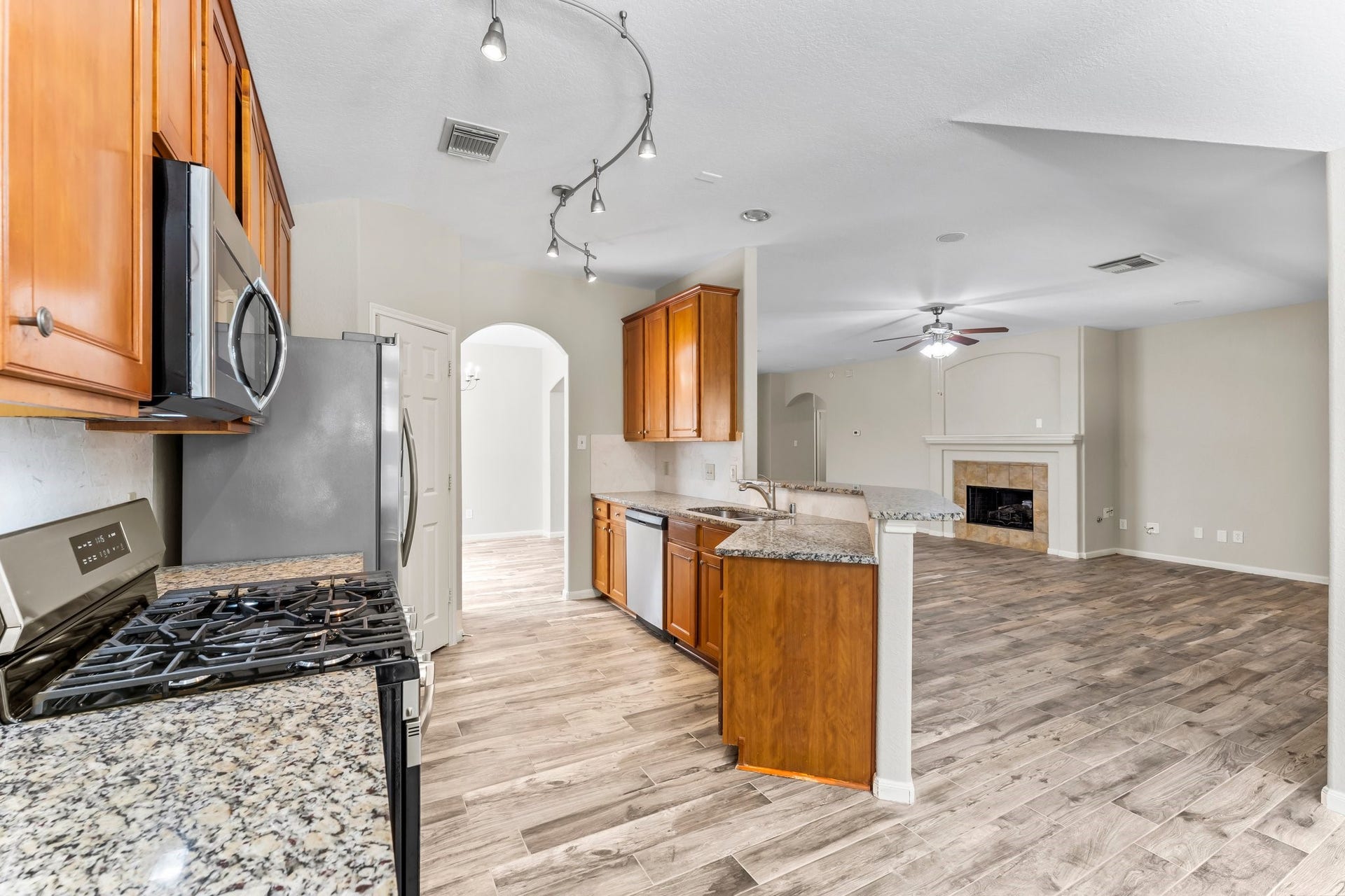 34 Bryce Branch Circle, The Woodlands, TX 77382 Kitchen is open to the Family room so it's easy to interact with family or guests while preparing dinner or dessert.